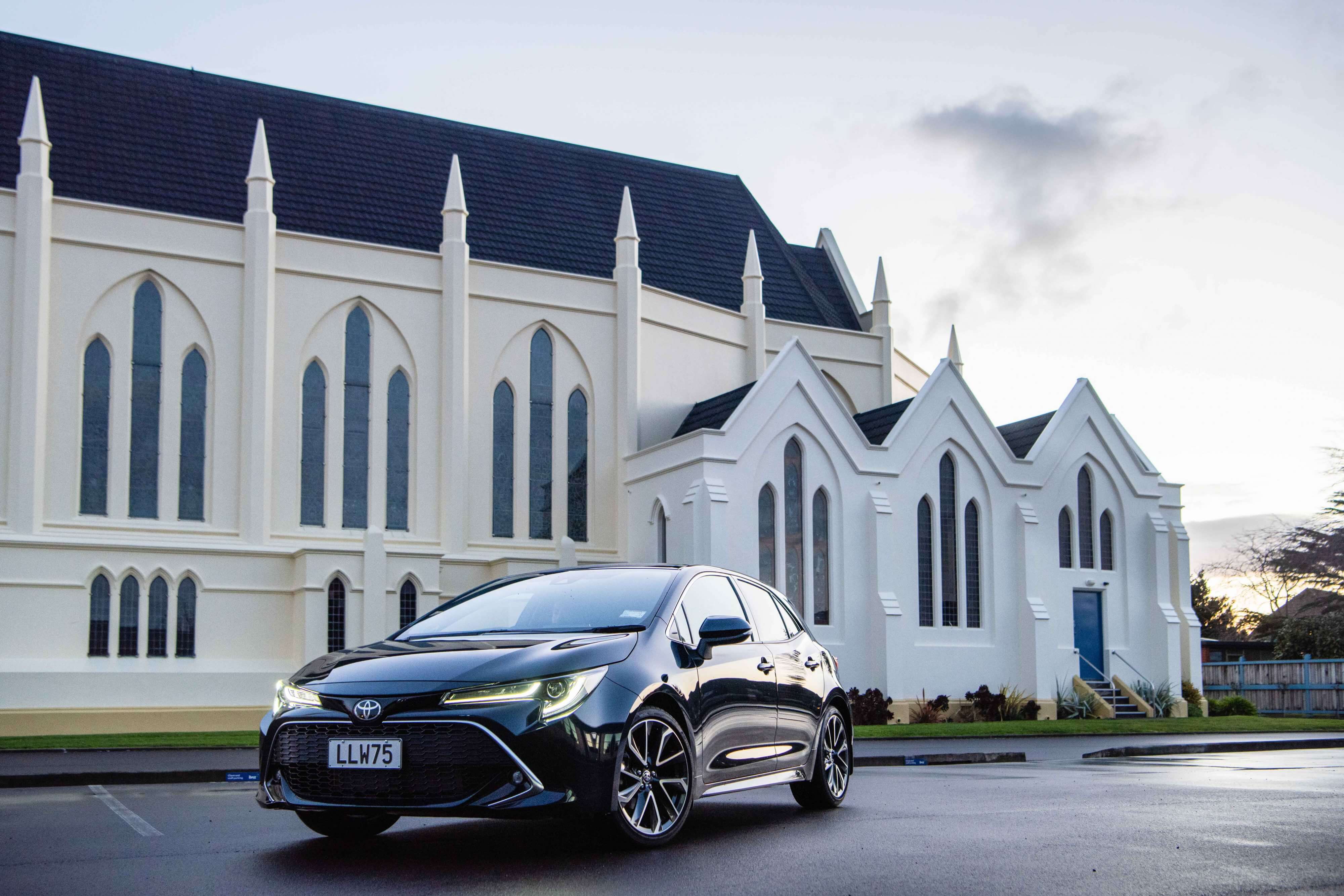 2018 Toyota Corolla hatch, ZR petrol, Peacock Black, front three quarter shot, church