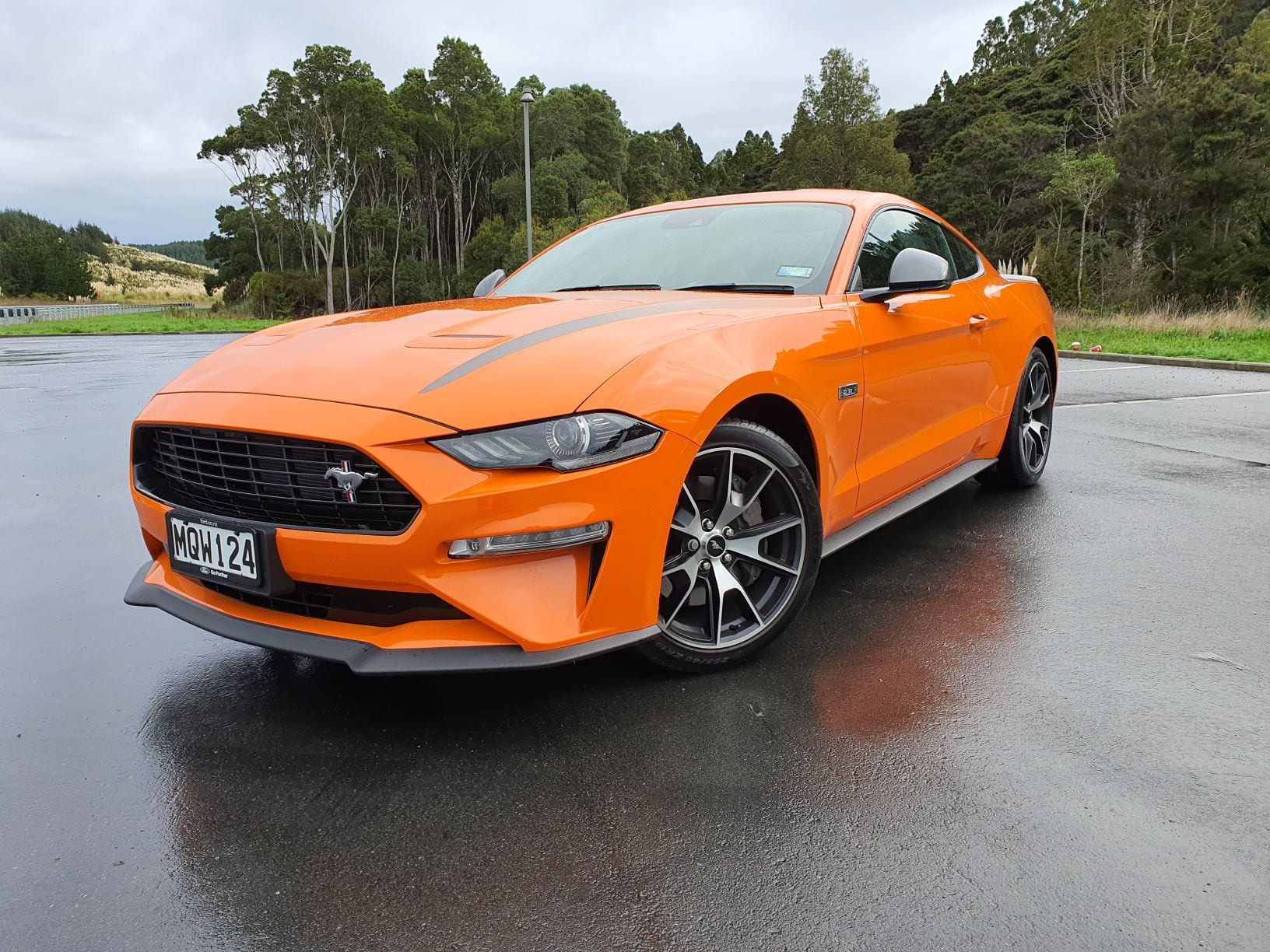 A frontal view of the 2.3L turbo Ford Mustang in bright orange