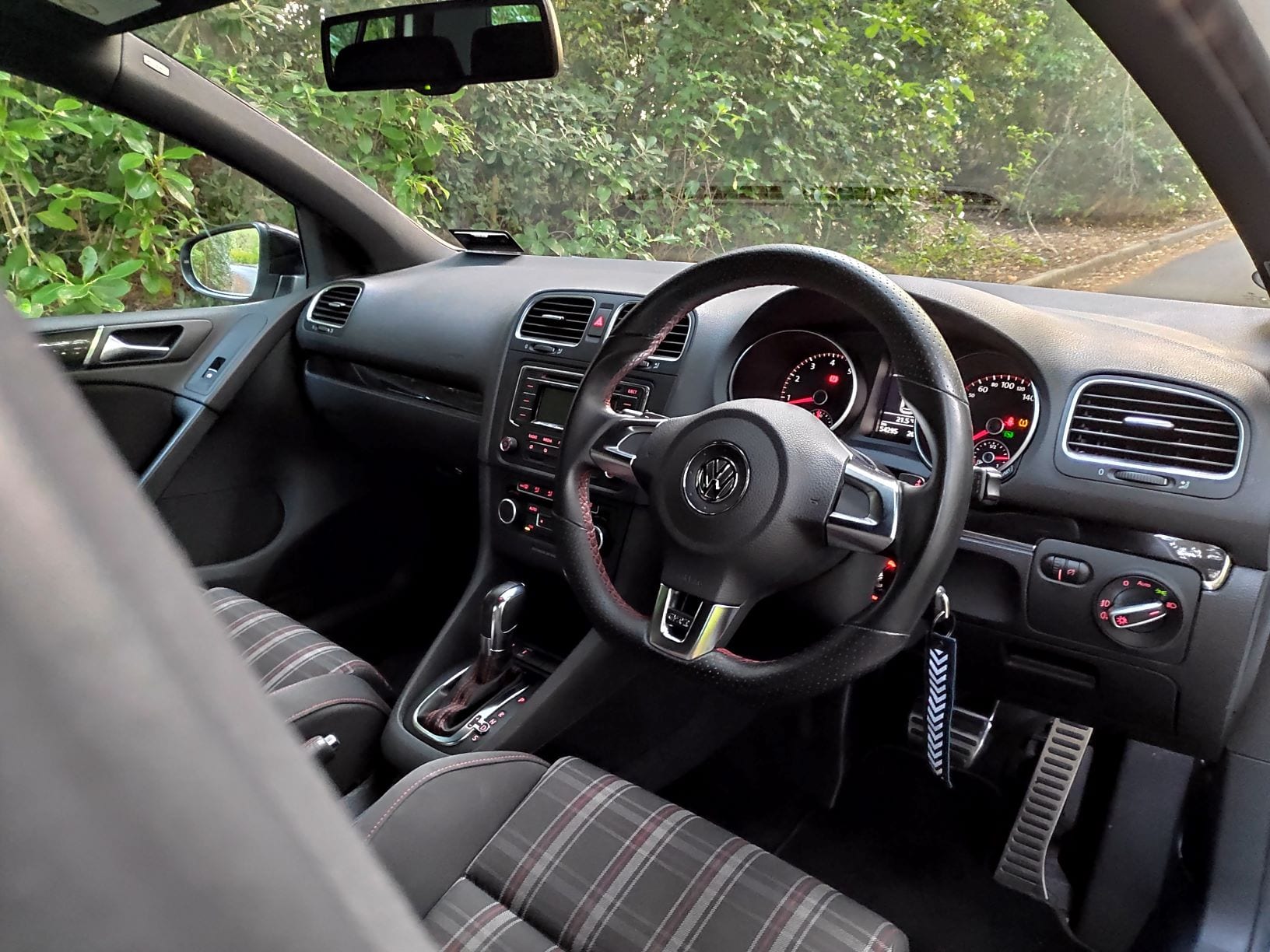Look at those tartan seats and the red stitching, how could you not want this in your life?! The interior of the Volkswagen Golf GTI.
