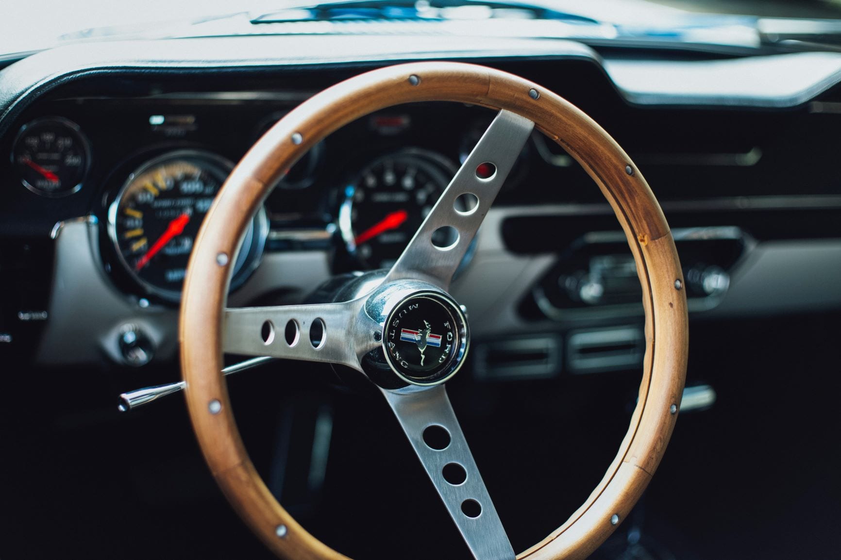 The interior of a classic Ford Mustang.