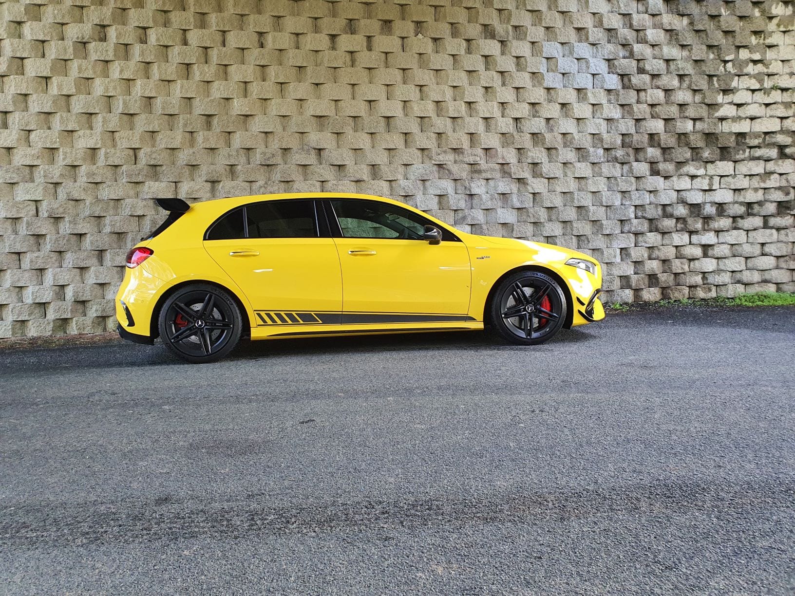 A side view of the Mercedes A45 S AMG edition 1 in yellow