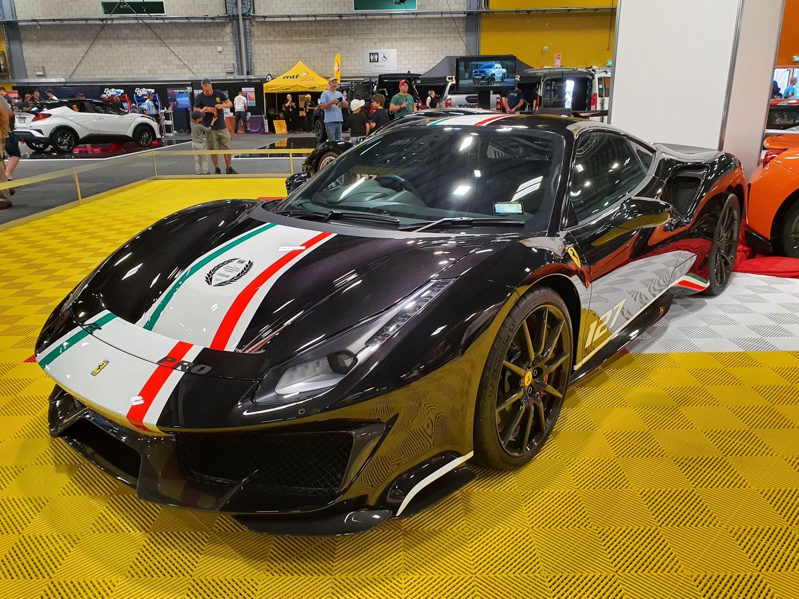 A black Ferrari Pista Piloti