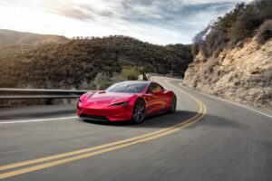 Moving shot of the Tesla roadster