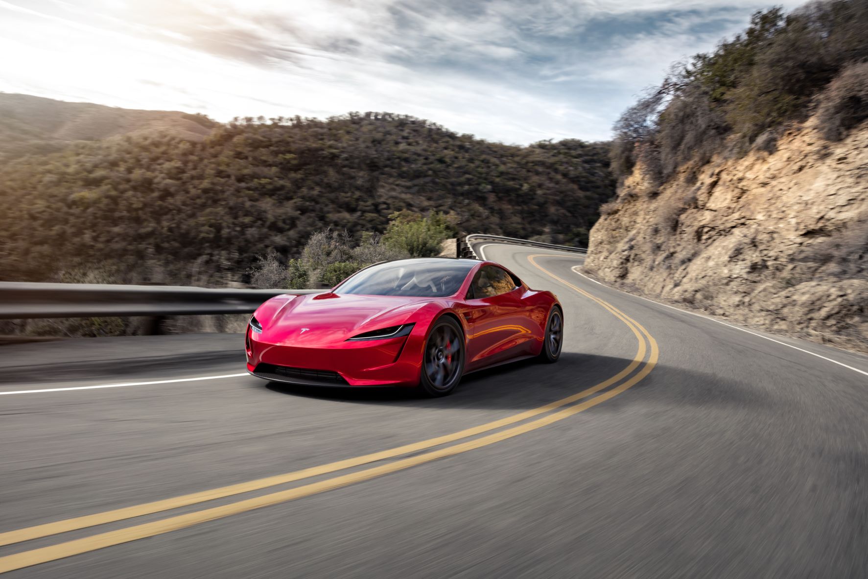 Moving shot of the Tesla roadster