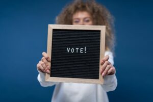 Stock photo of blackboard with vote written on it