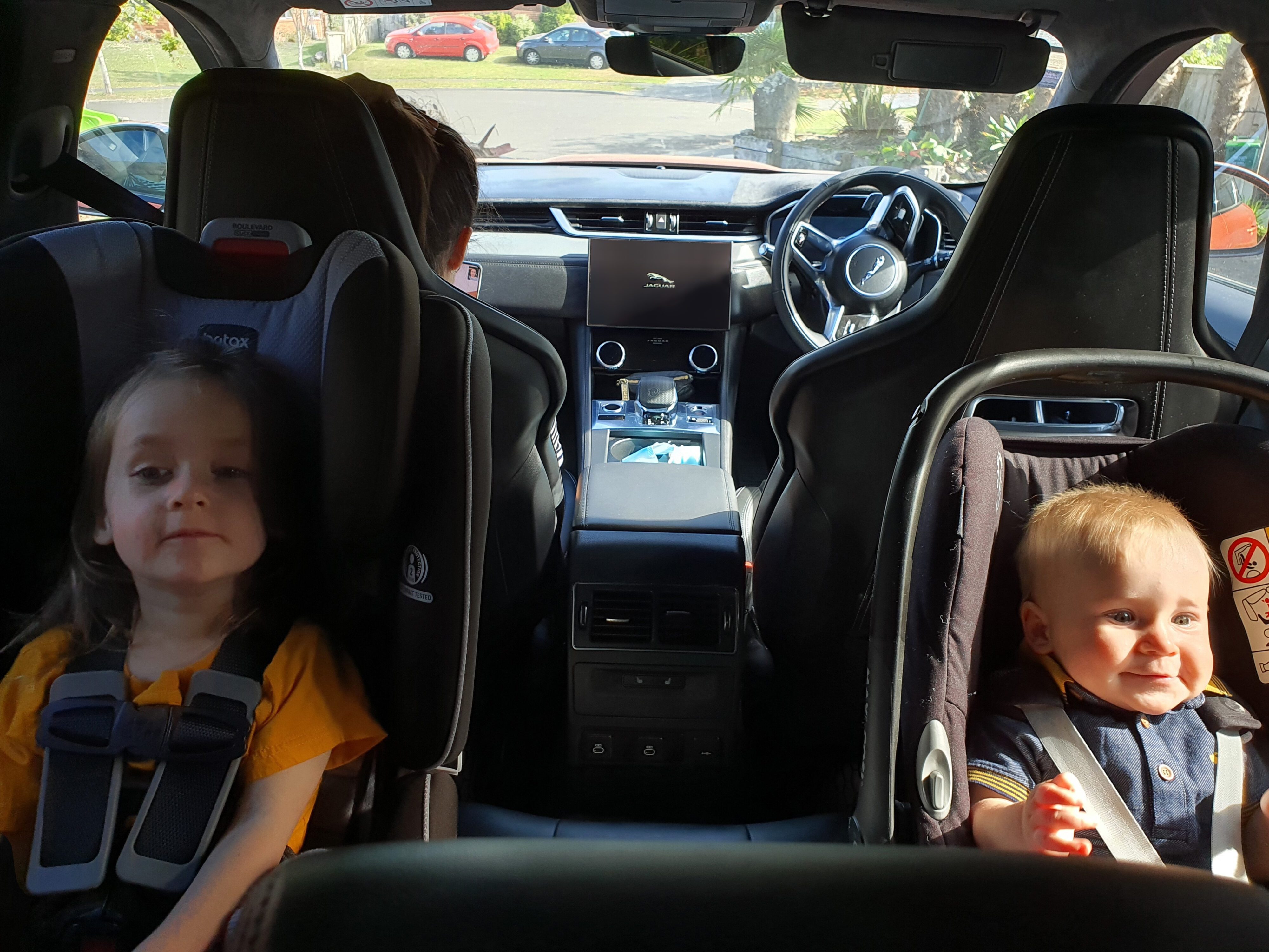 Kids in the back of a Jaguar F-PACE SVR