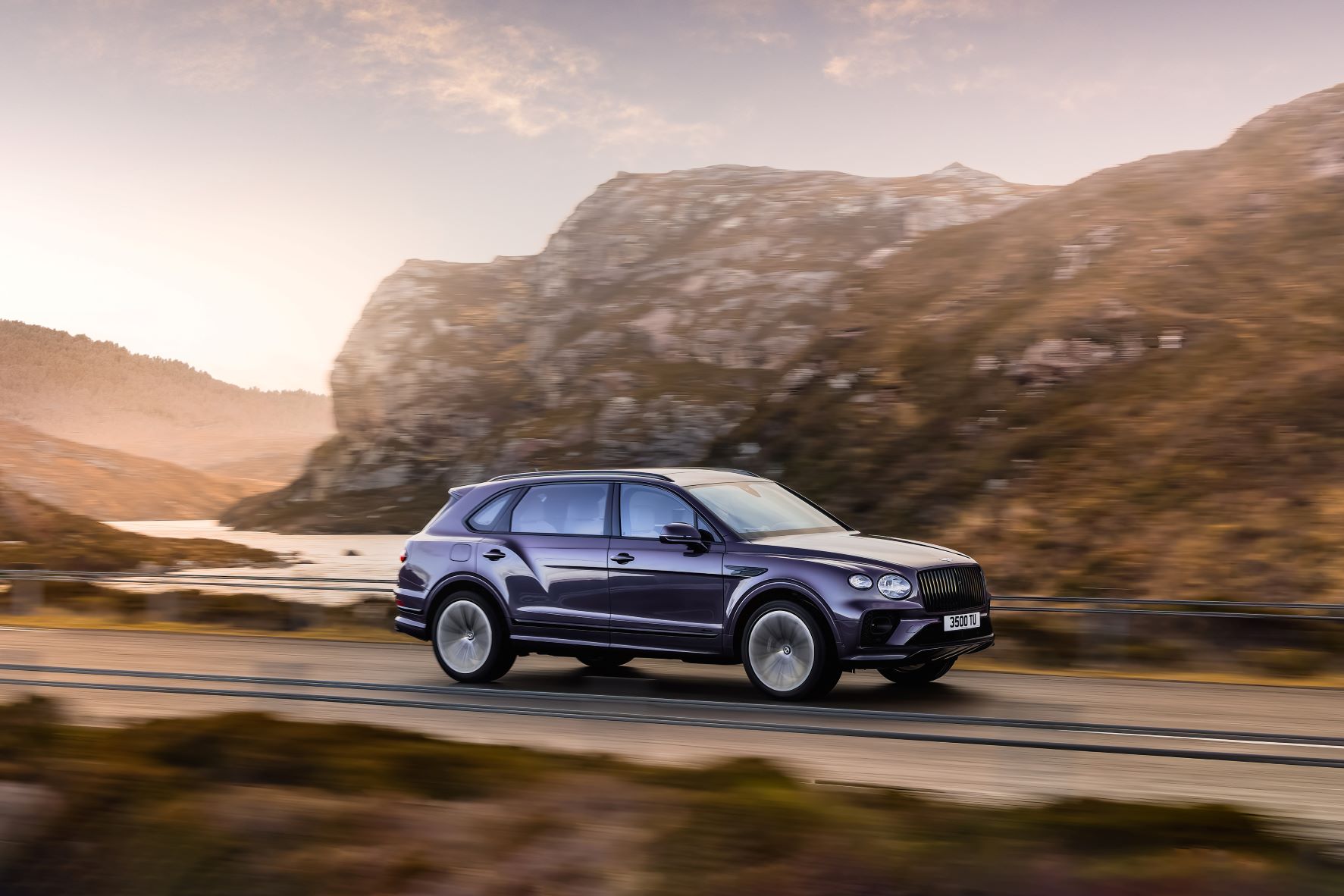 Zoomed out view of a purple Bentley Bentayga Extended Wheelbase in purple