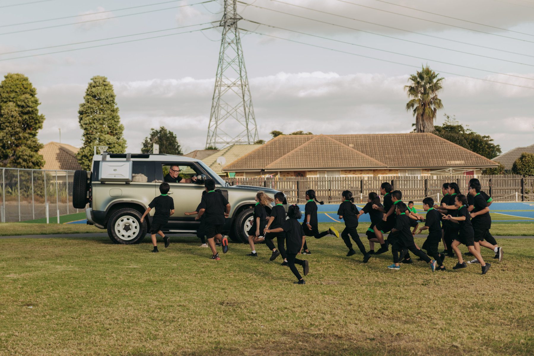 Sir John Kirwan in a Land Rover Defender