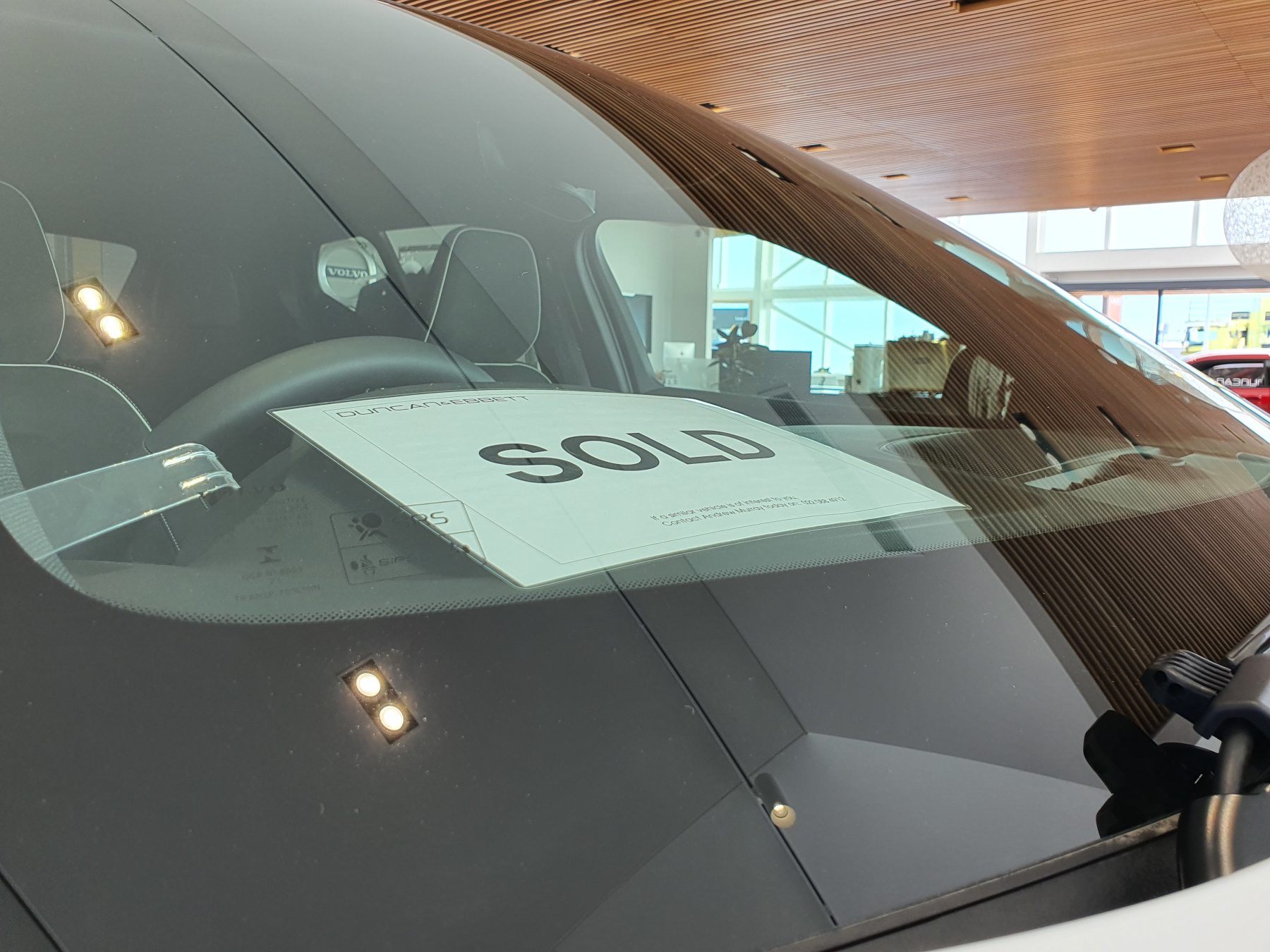 Sold sign on a car window