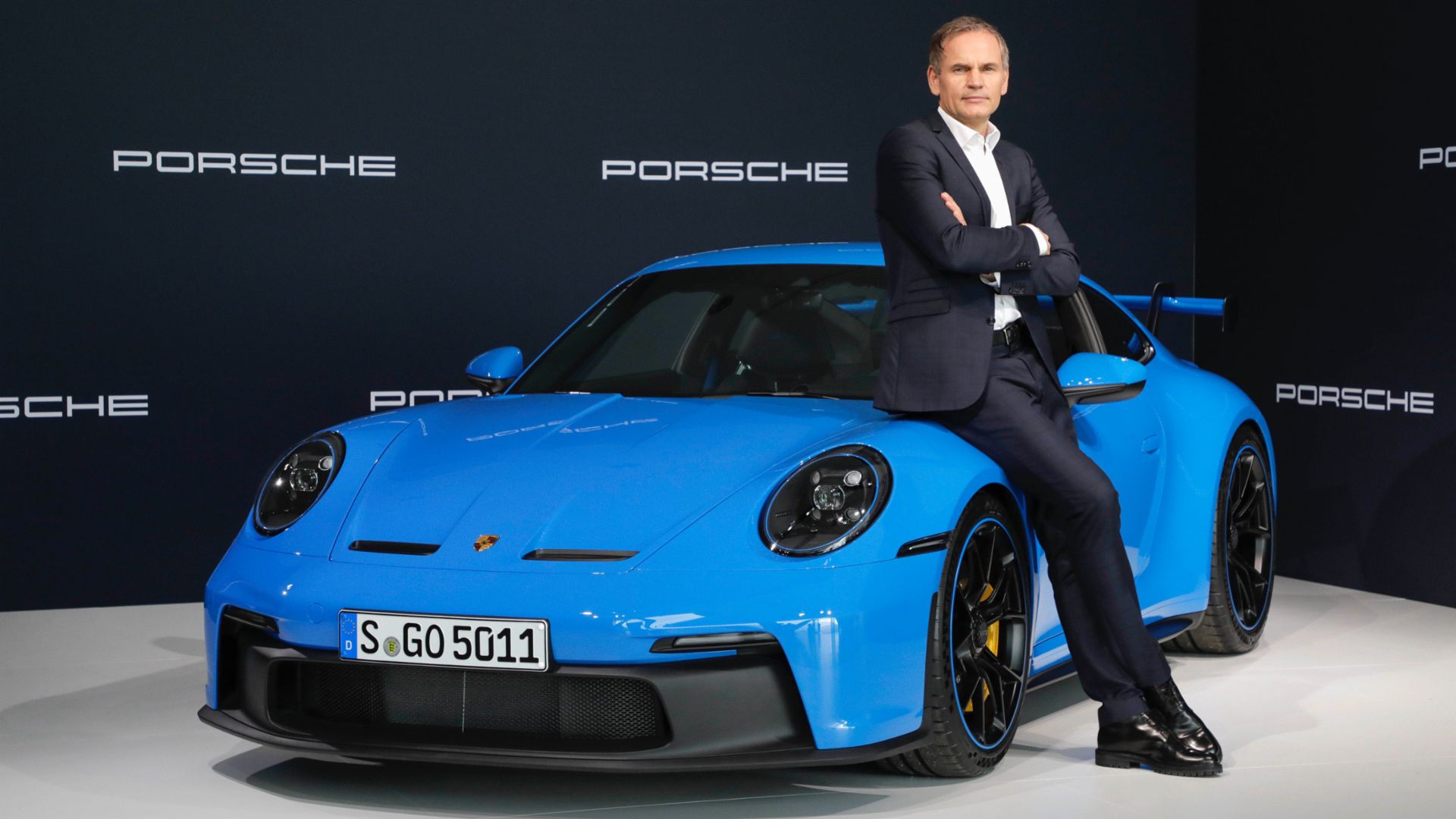 Oliver Blume photographed with a Porsche 911 GT3