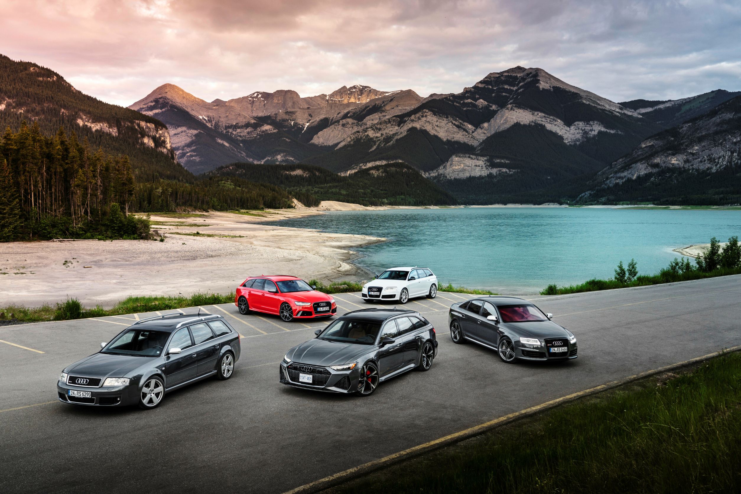 Four generation of the Audi RS6 by a lakeside