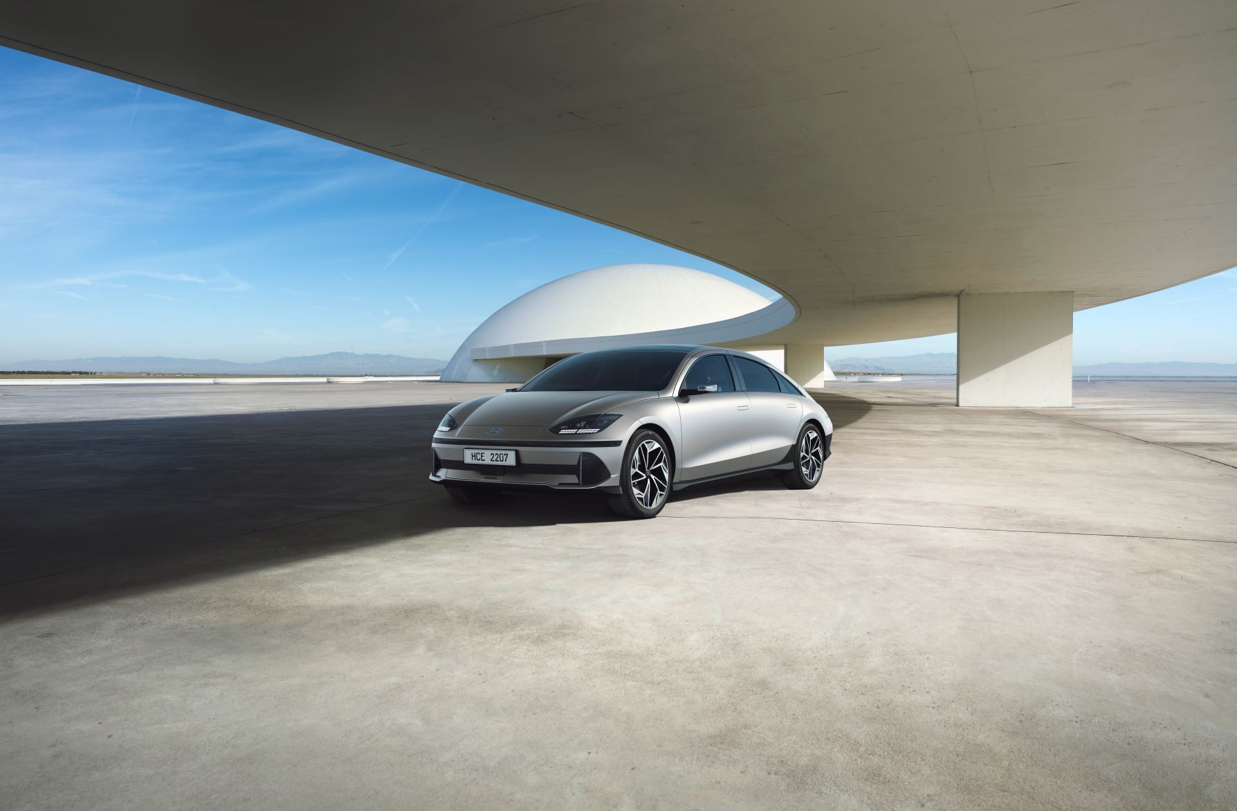 Zoomed out front three quarters view of the new Hyundai IONIQ 6