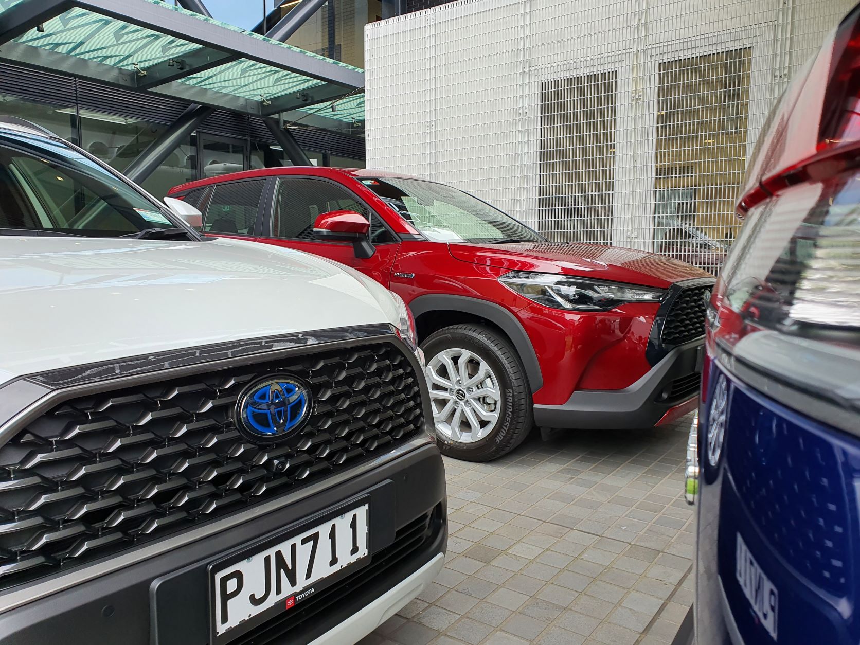 Three different Corolla Cross models captured in one photo