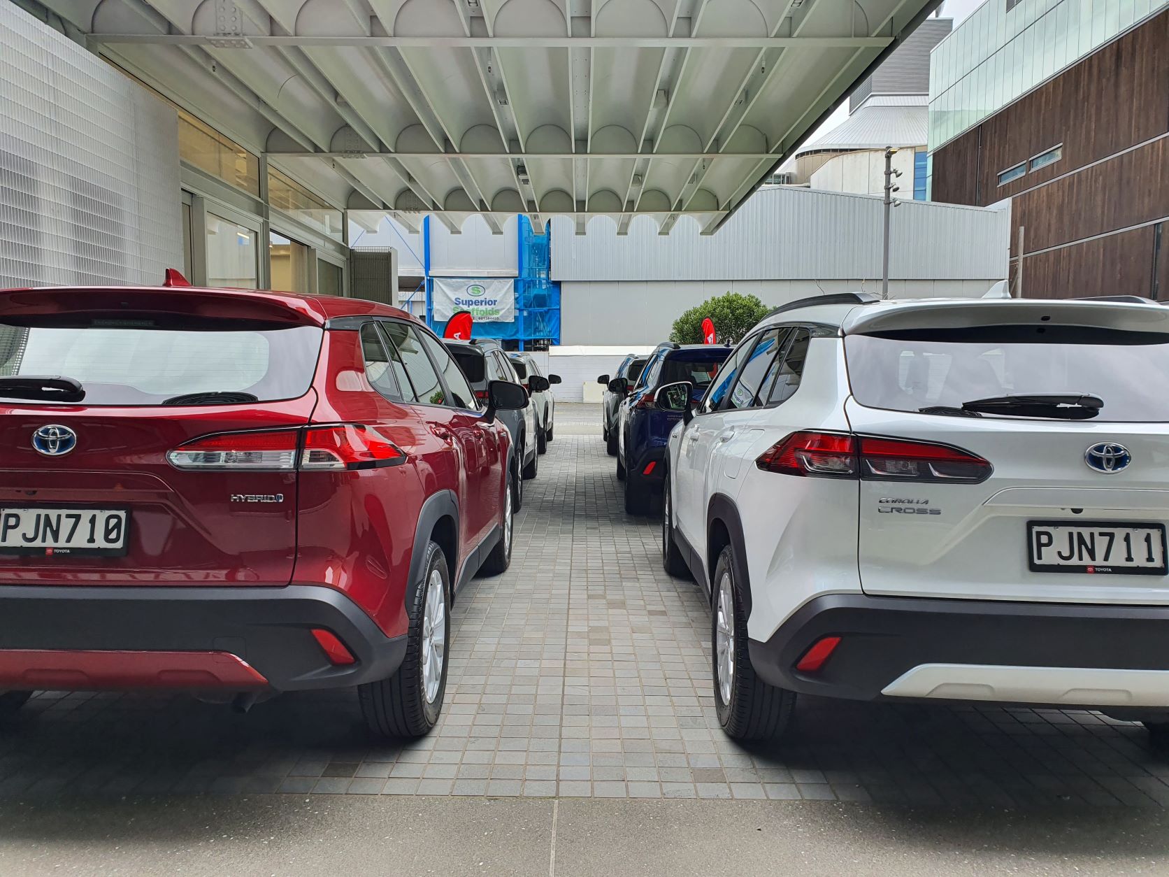 Rear shot of the six Toyota Corolla Crosses lined up outside the Annex, Auckland