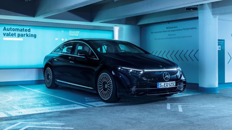 A black Mercedes-Benz EQS sedan parked in a Bosch Mercedes-Benz marked driverless parking bay.