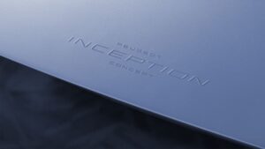 A close-up photo of the Peugeot Inception Concept logo