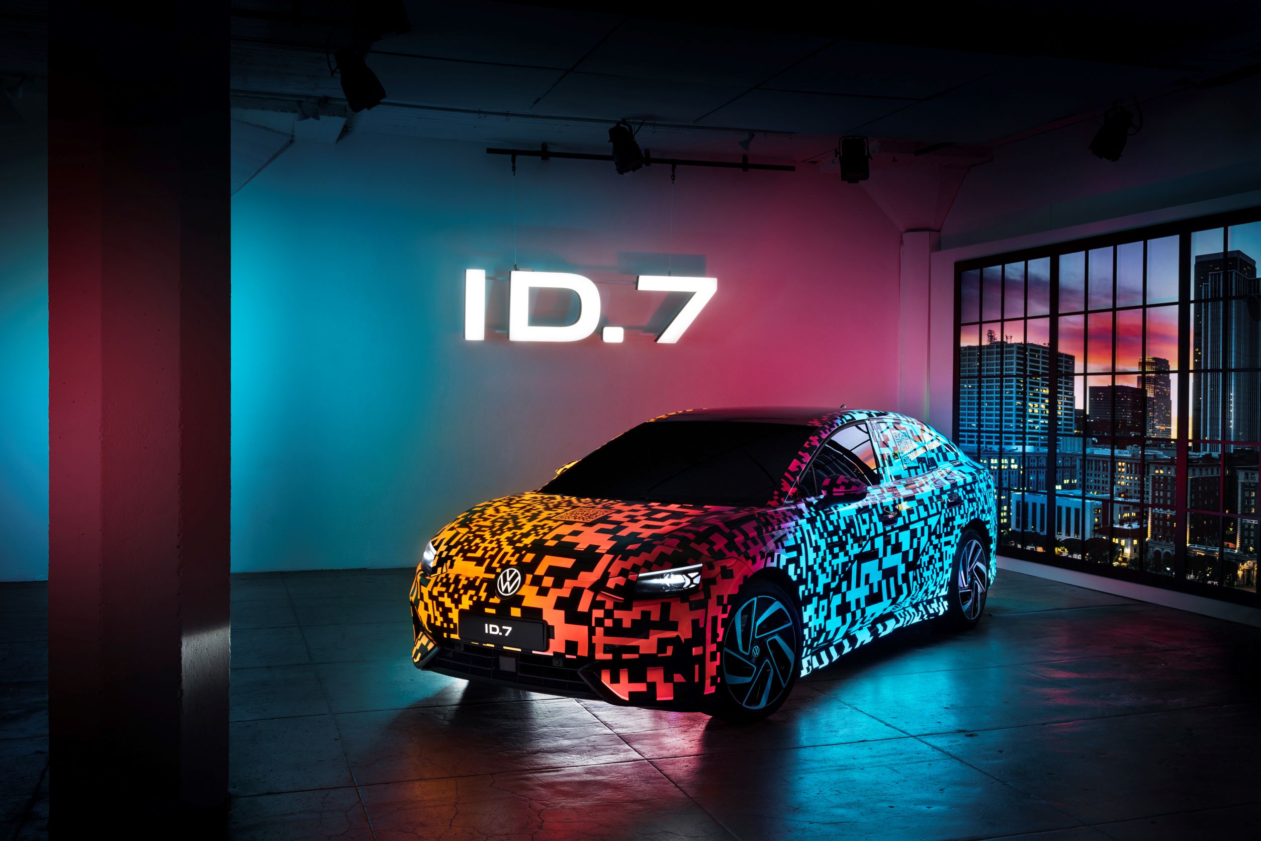 Front three quarters view of a Volkswagen ID.7 in camouflage