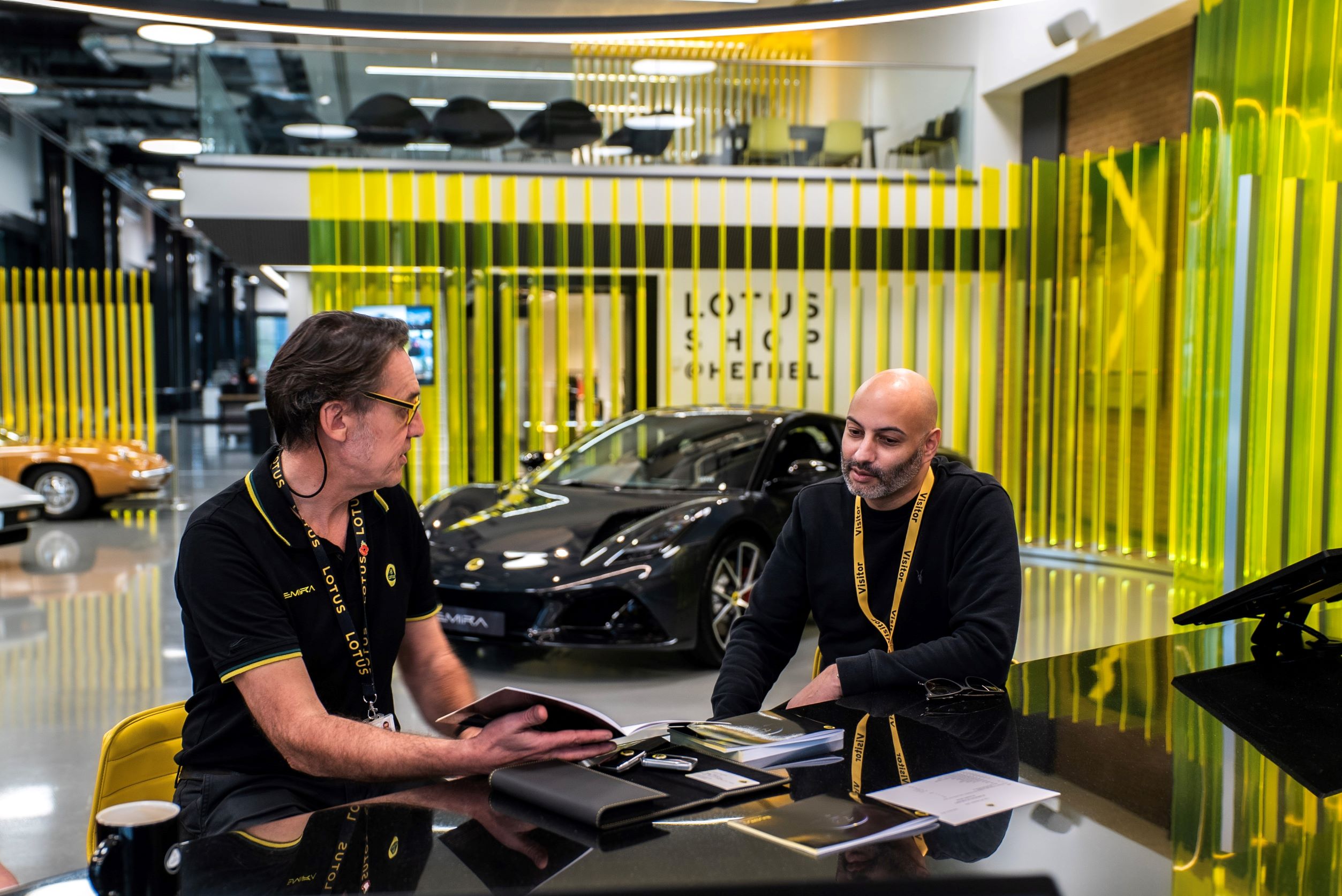 Shaan Kodituwakku receiving a handover of his new Lotus Emira from Scott Walker, Head of Hethel Retail Operations.