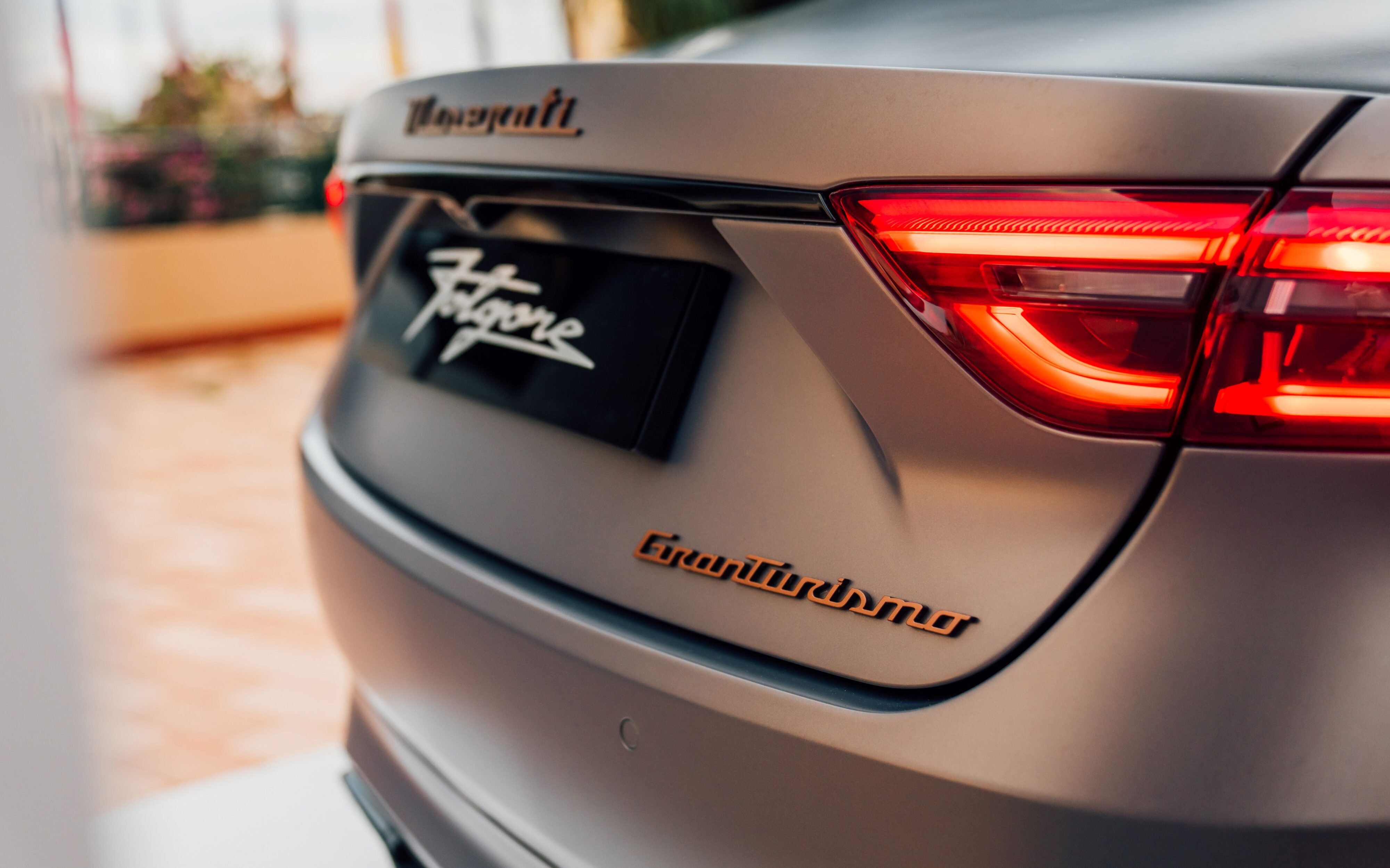 Close up of the GranTurismo badge on the Maserati GT Folgore at the Rolex Monte-Carlo Masters