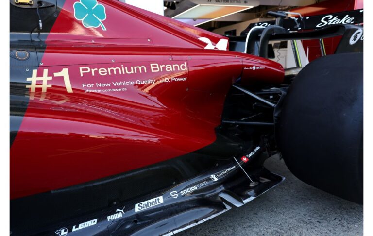 Decals celebrating Alfa Romeo's big win at the recent J.D. Power awards adorn the side of the Alfa Romeo C43 F1 racecar