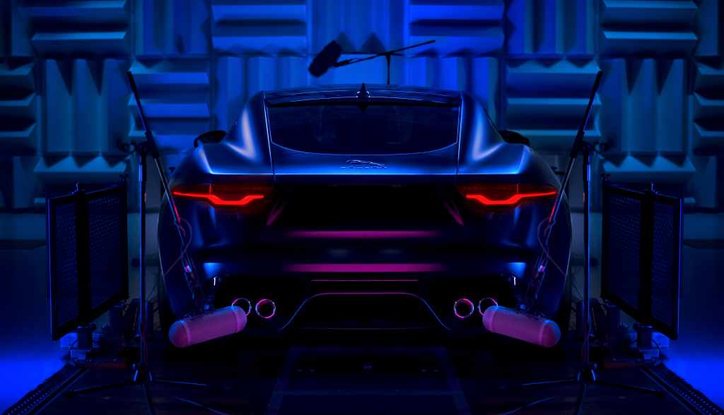 A promotional photo of a Jaguar F-Type R V8 in a sound recording room