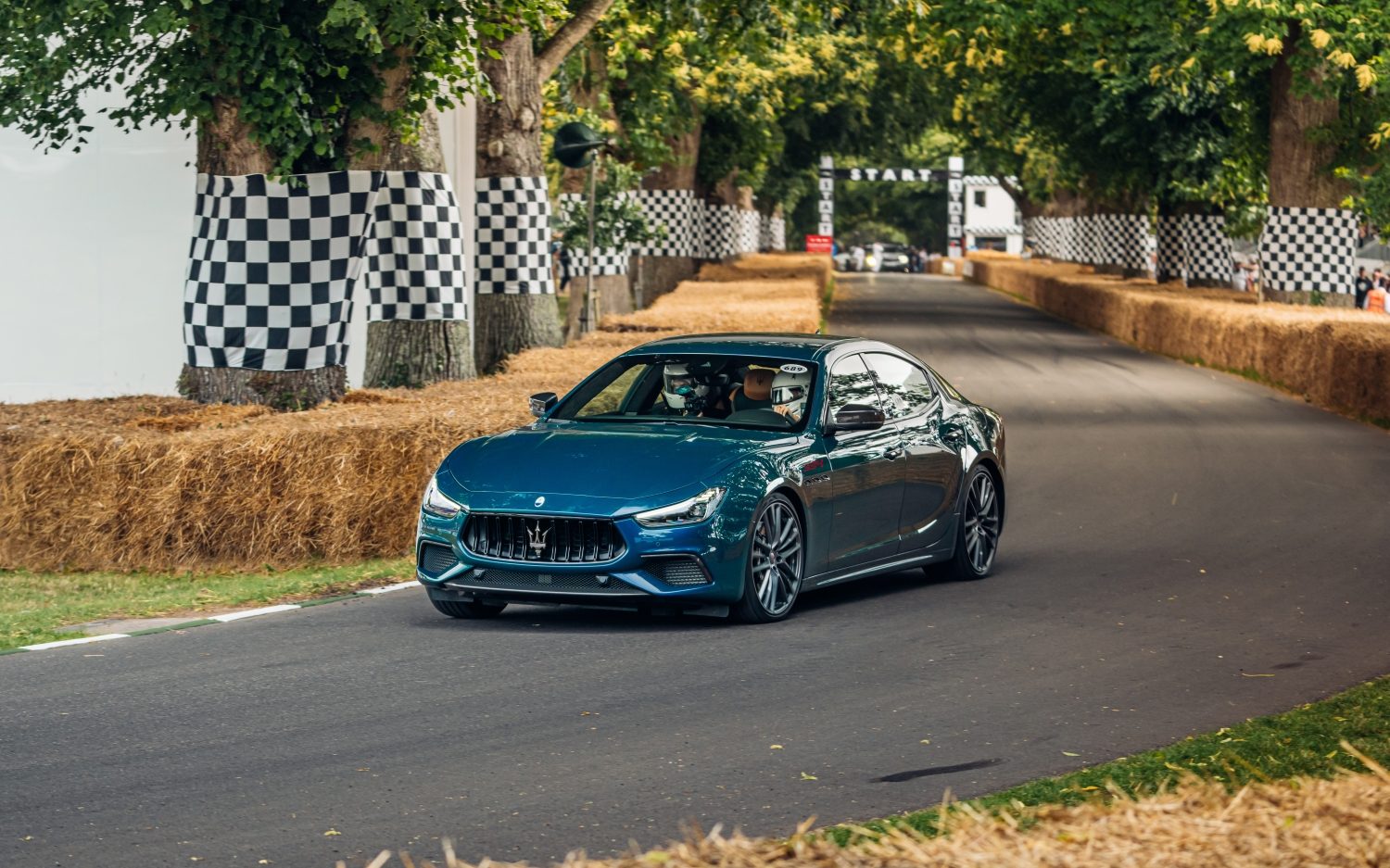 A Maserati Ghibli 334 Ultima taking on the famous Goodwood Hill Climb