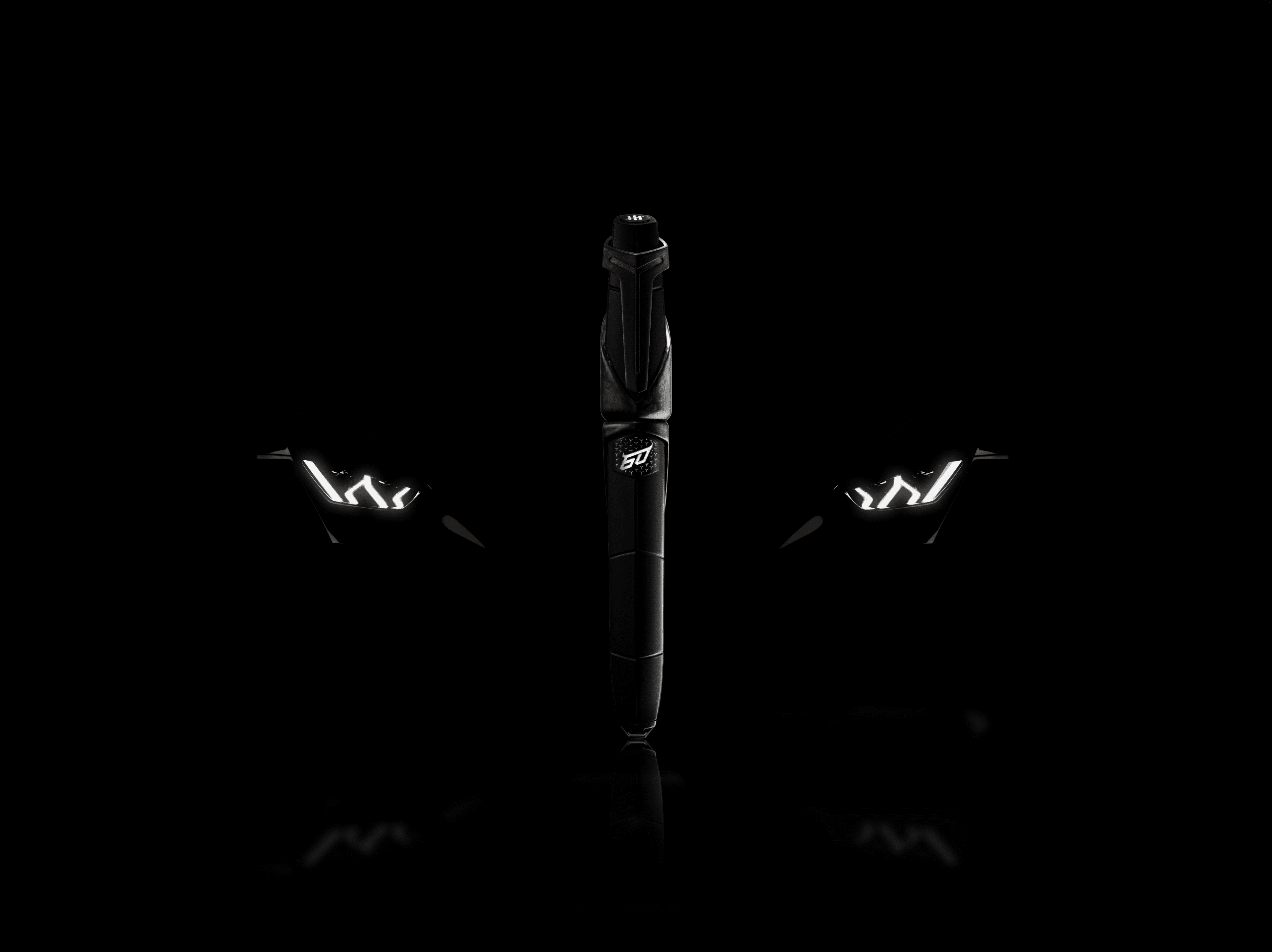 A promotional photo of a Lamborghini Montegrappa pen in front of a Lamborghini Huracan