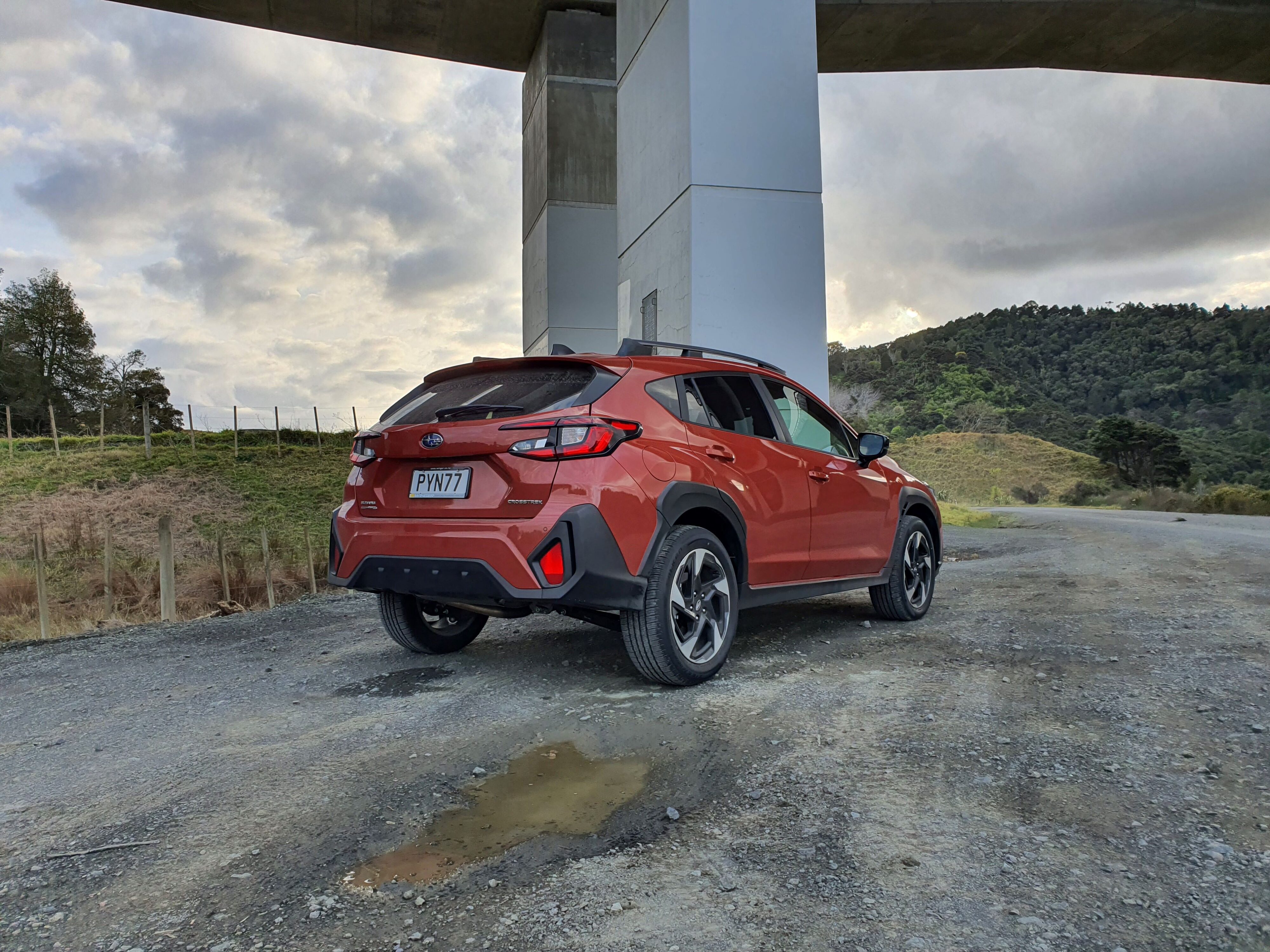 Rear three quarters view of the 2023 Subaru Crosstrek Petrol Premium in Sun Blaze Pearl