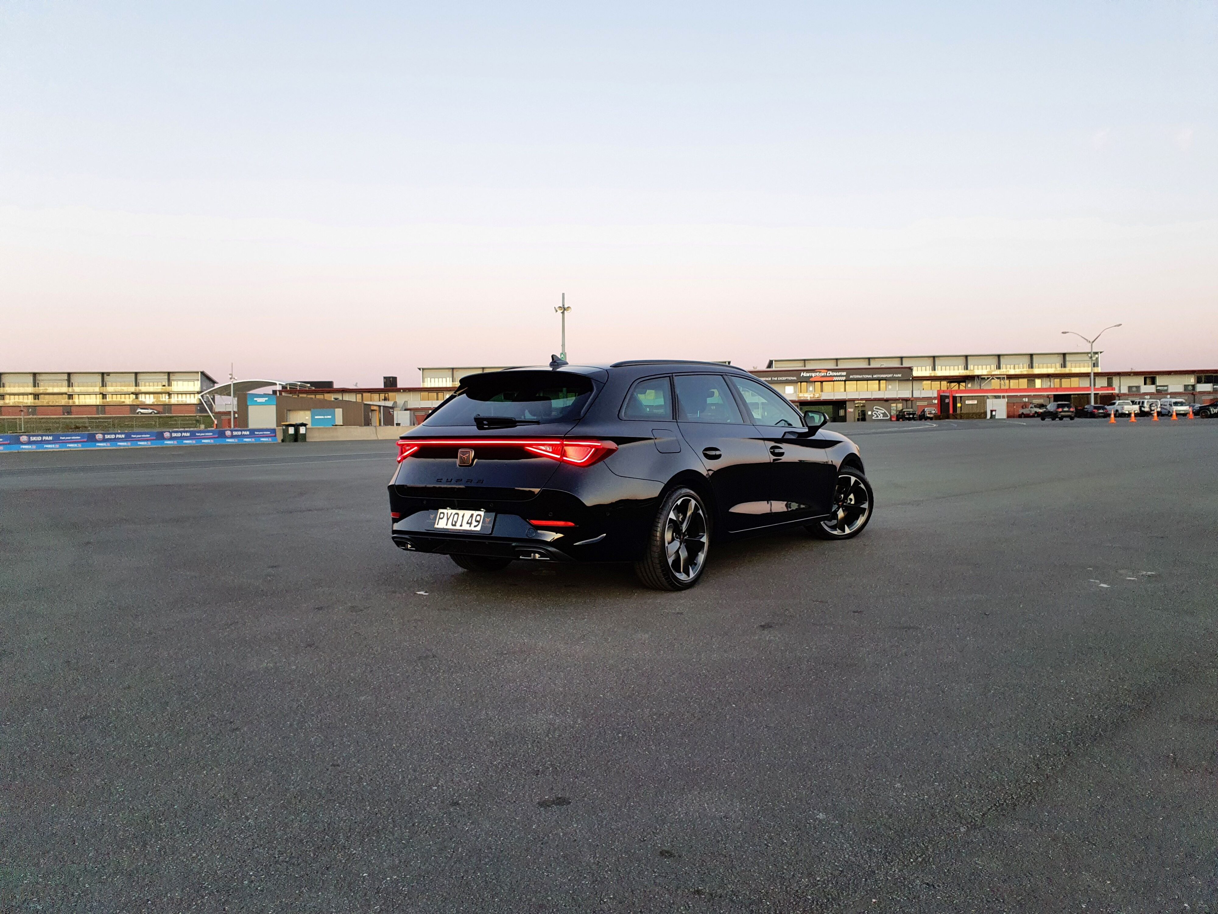 Rear three quarters view of a 2023 Cupra Leon V Sports Tourer in Black.