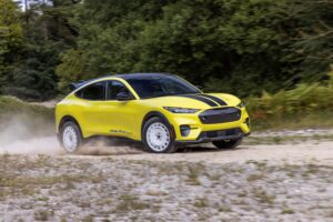 Motion shot of a 2023 Ford Mustang Mach-E GT on a rally stage.