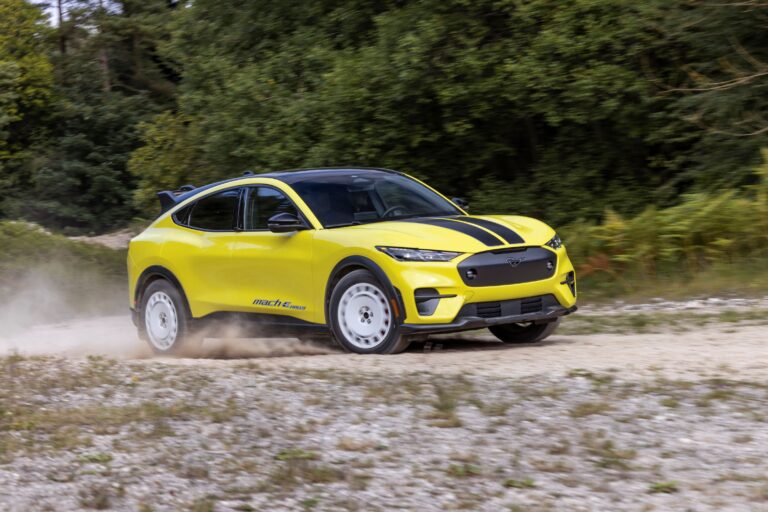 Motion shot of a 2023 Ford Mustang Mach-E GT on a rally stage.