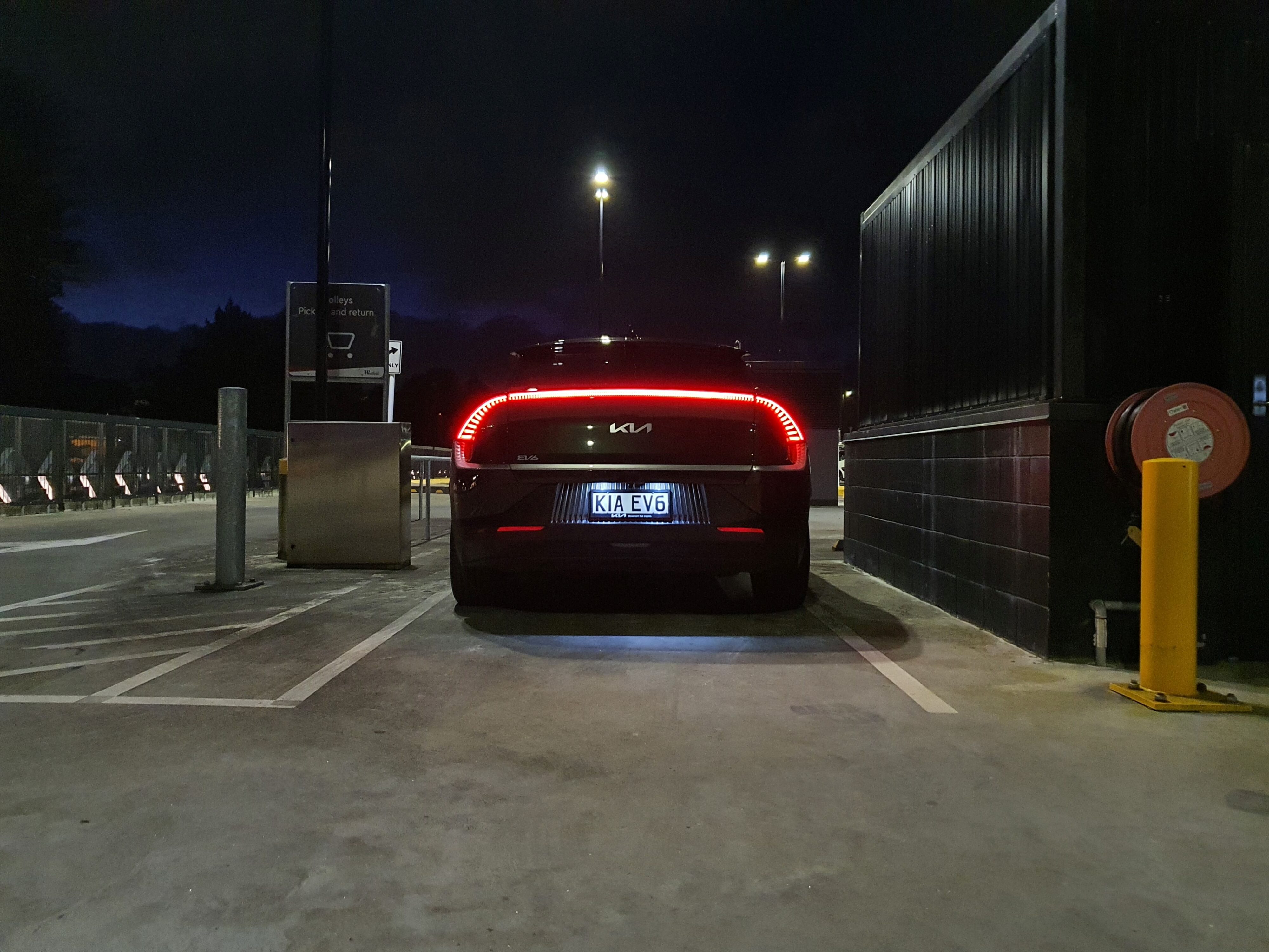 Rear straight on view of a 2023 Deep Forest Green Kia EV6 Air Long Range.