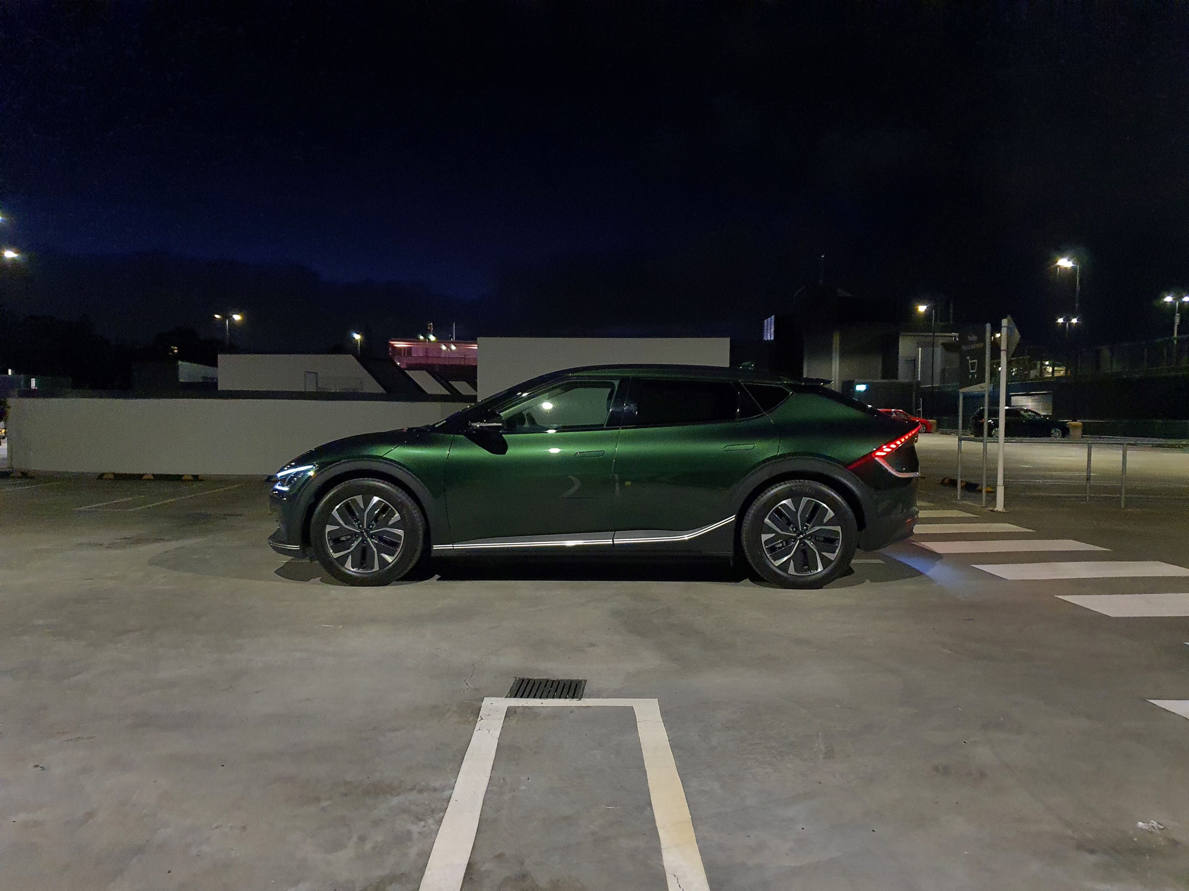 Side view of a 2023 Deep Forest Green Kia EV6 Air Long Range.
