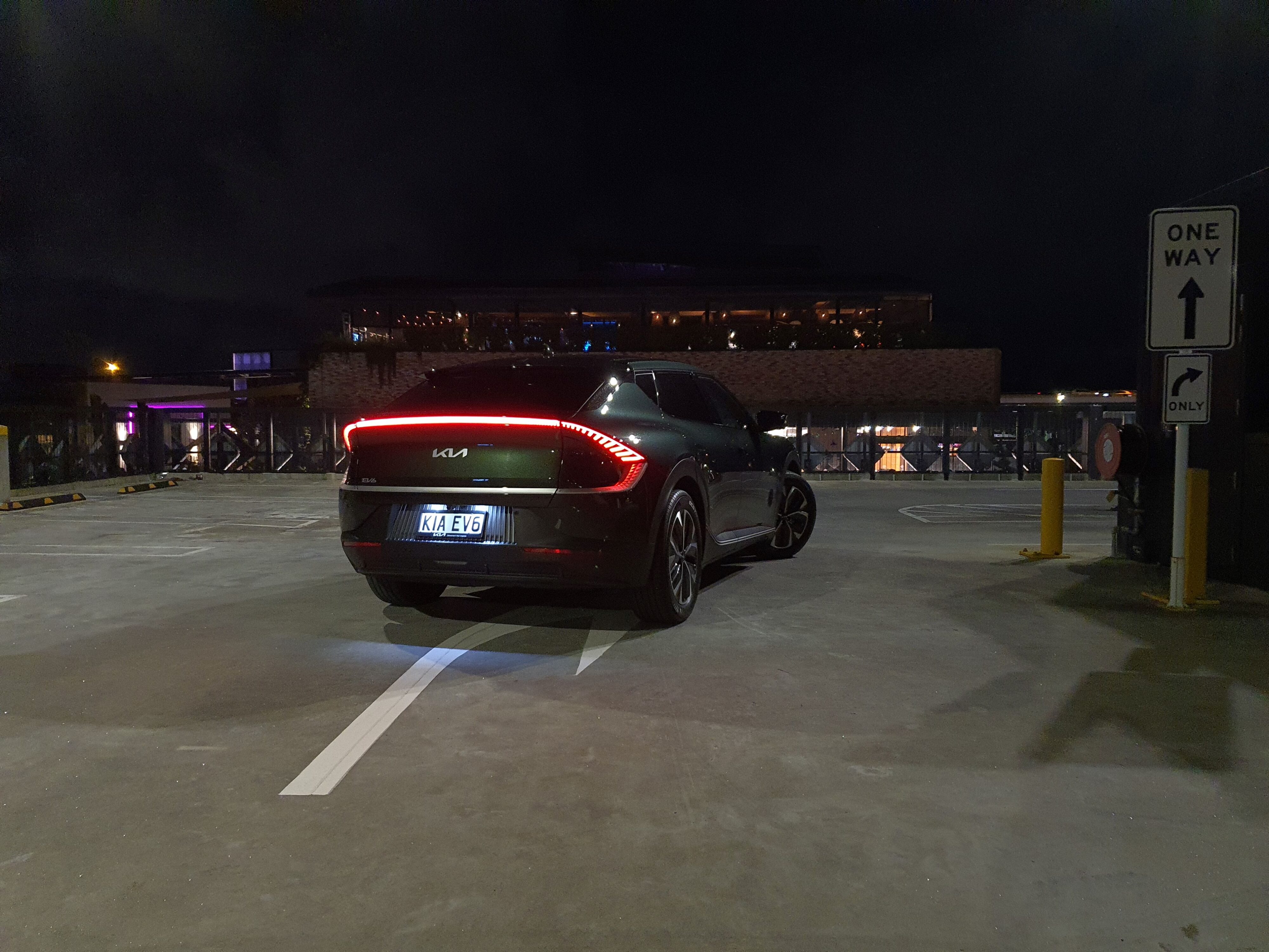 Rear Three Quarters view of a Deep Forest Green 2023 Kia EV6 Air Long Range.