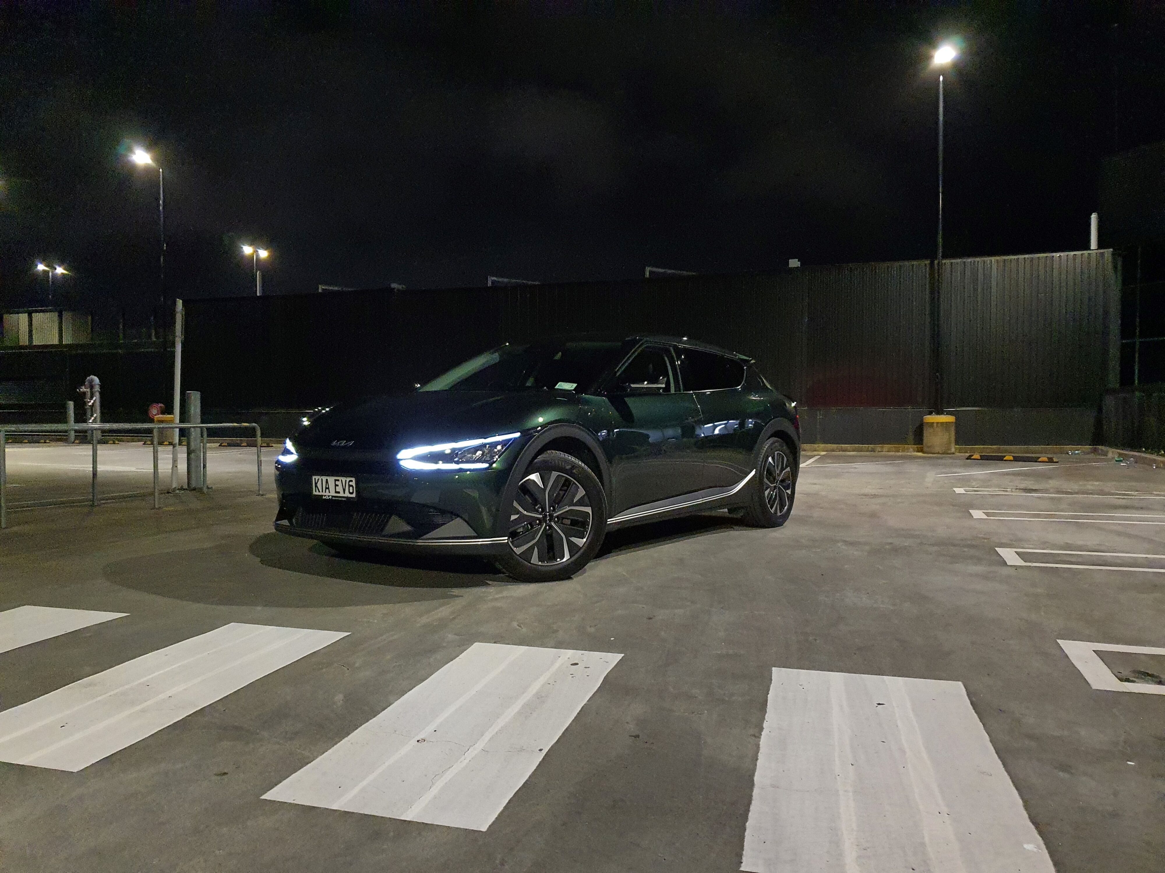 Front three quarters view of a 2023 Deep Forest Green Kia EV6 Air Long Range
