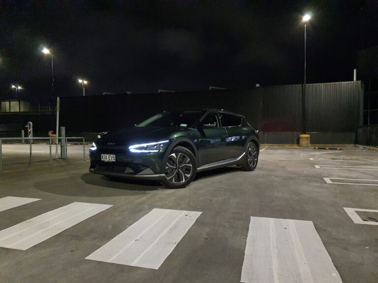 Front three quarters view of a 2023 Deep Forest Green Kia EV6 Air Long Range