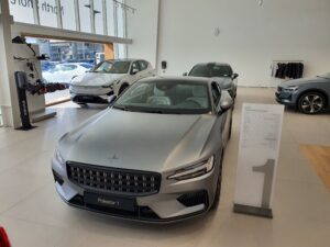 Overhead view of a Polestar 1 in grey, Polestar 2 in grey and a Polestar 3 in white.