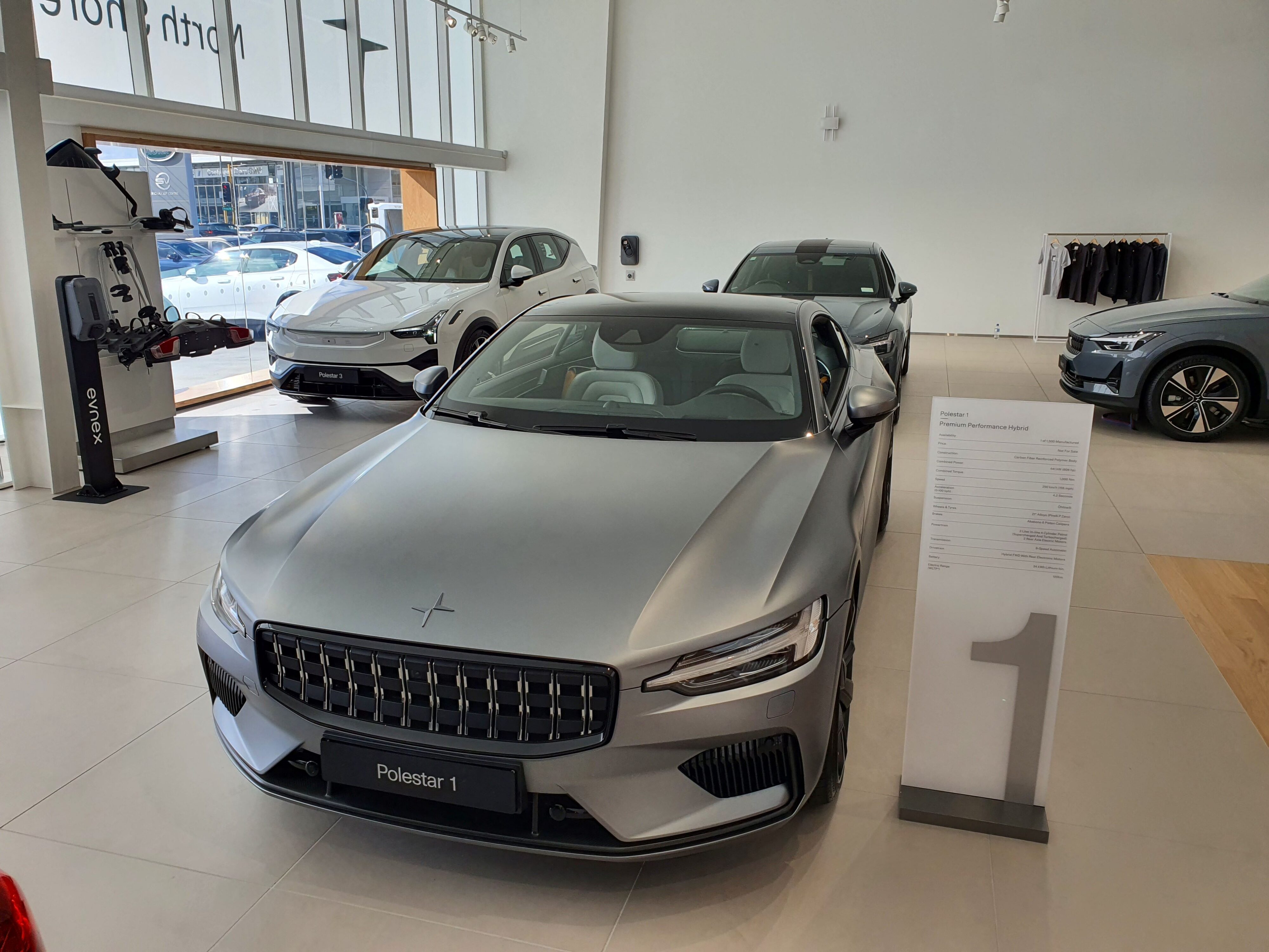 Overhead view of a Polestar 1 in grey, Polestar 2 in grey and a Polestar 3 in white.
