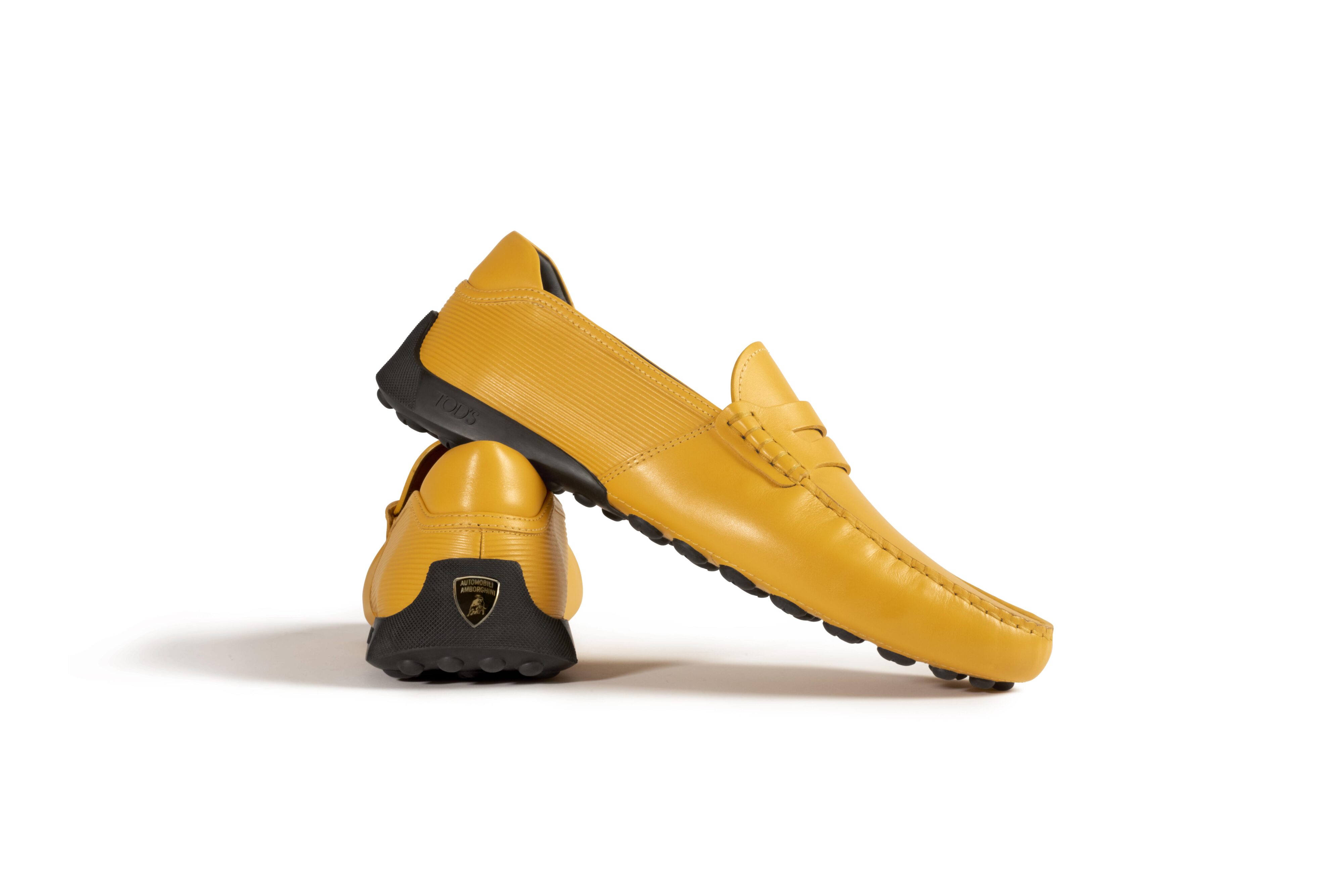 Photo of the Tod's Gommino loafers in orange as part of the brand's collaboration with Lamborghini.