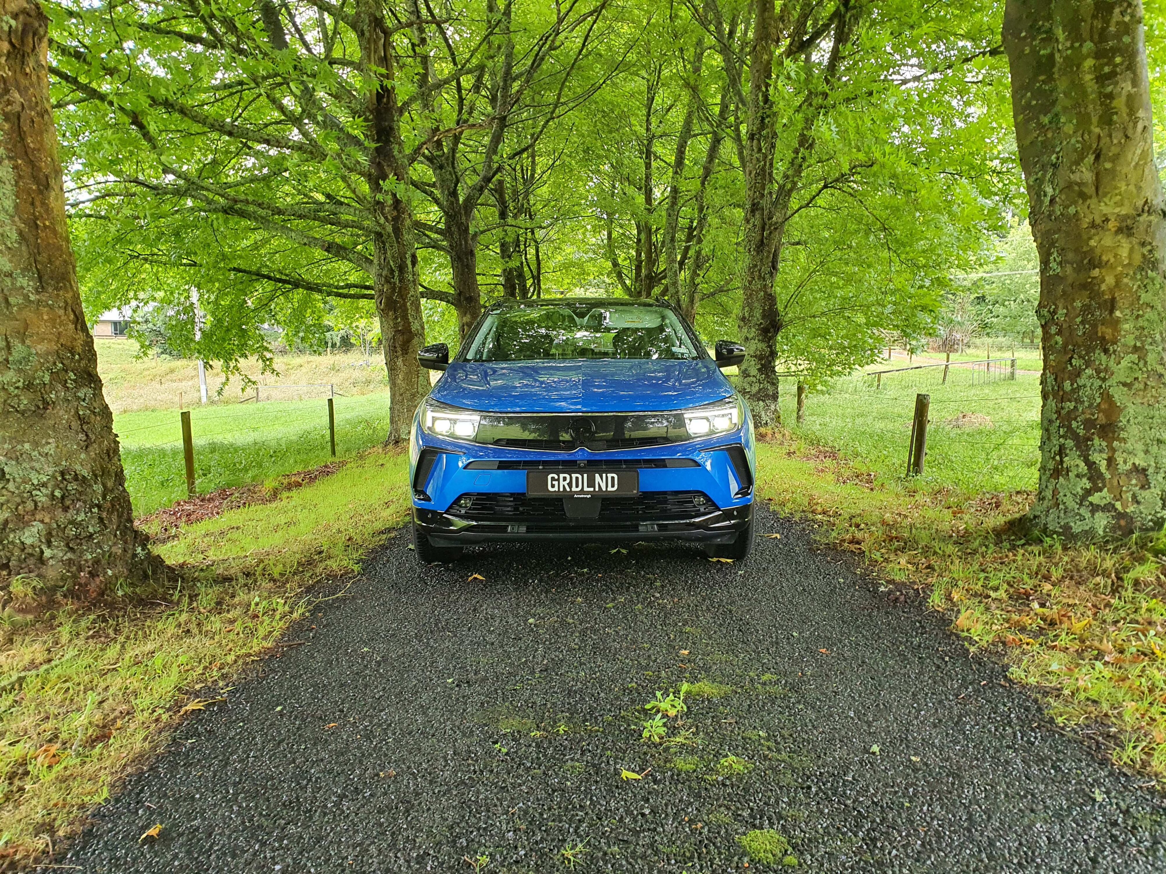 Photo of a Cobalt Blue Opel Grandland SRi at Tyburn Monastery, Rotorua, New Zealand.