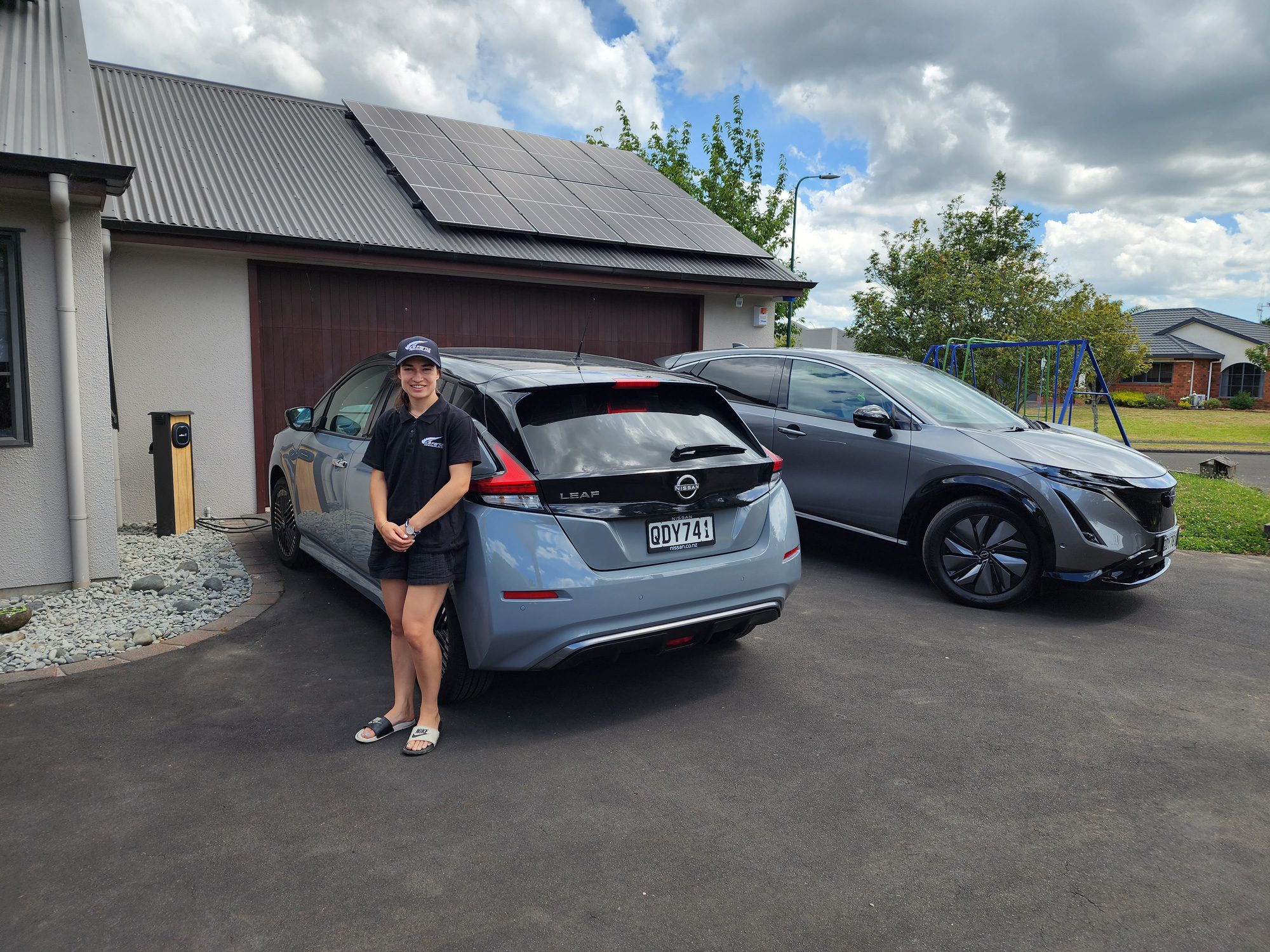 Ice Fern Anjali Mulari with her 2023 Nissan Leaf and Wallbox Pulsar Max EV charger on solar panels