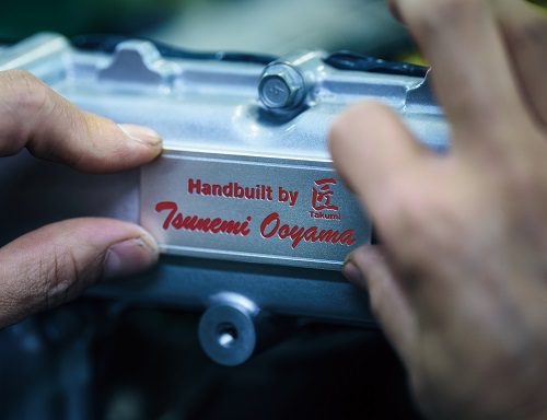 A special aluminium plate in the engine of a 2025 Nissan GT-R, installed by the maker of the engine.