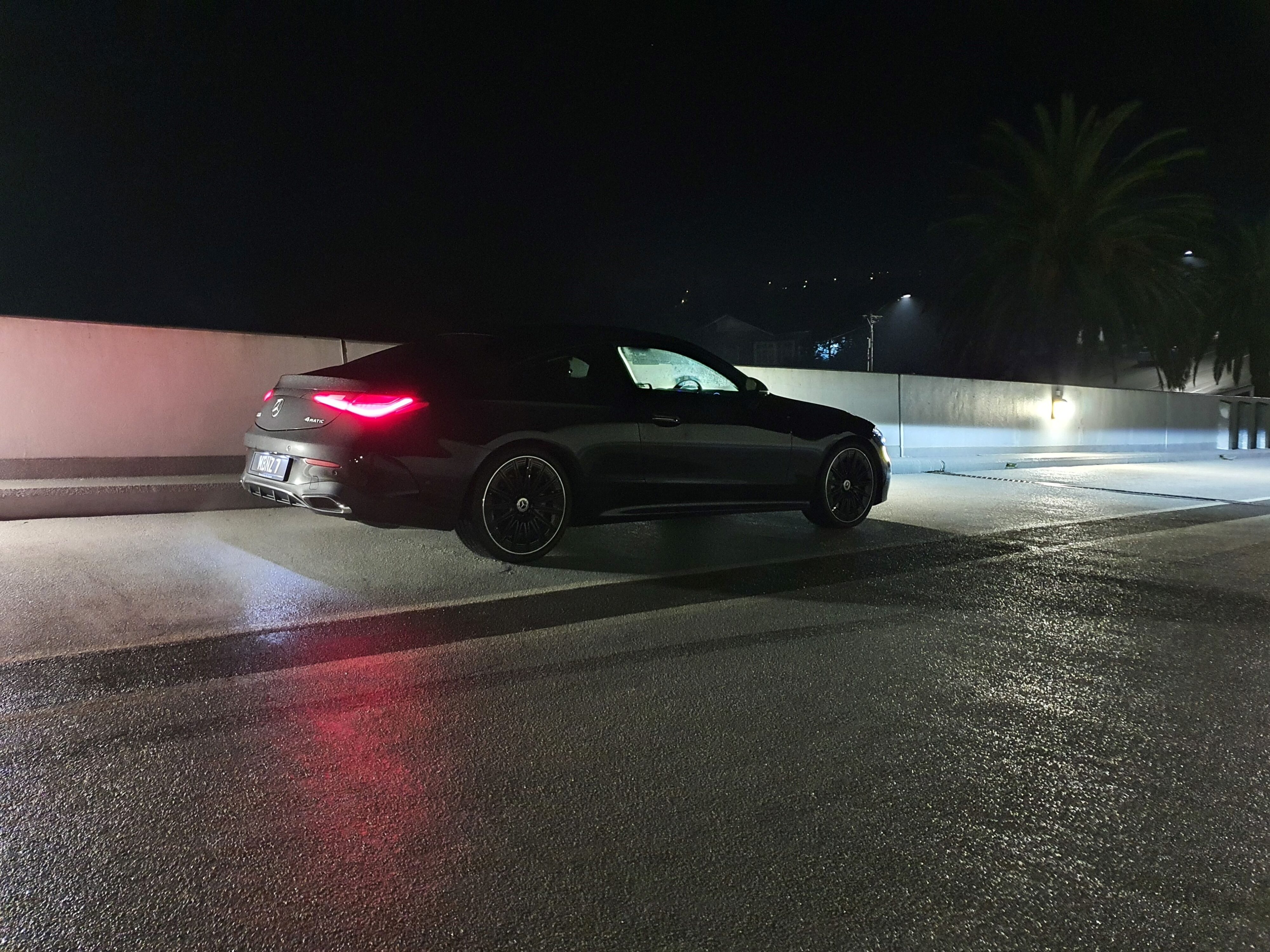 A rear three quarters photo of a 2024 Mercedes-Benz CLE300 in Black.
