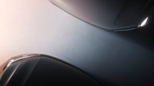A teaser image of the new Volvo EX90 and XC90 taken from above.