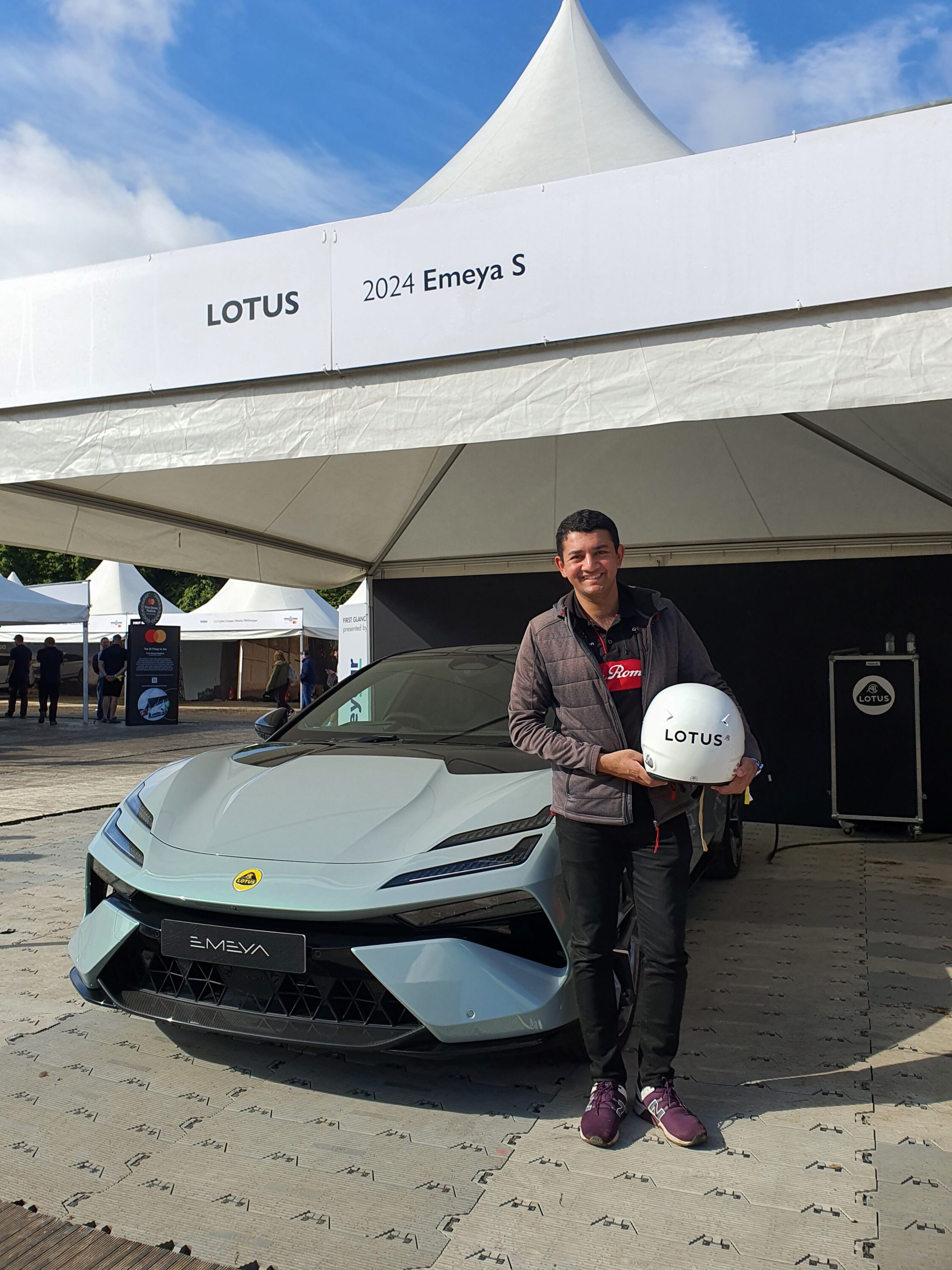 Matthew D'Souza with a Lotus Emeya S at the 2024 Goodwood Festival of Speed.