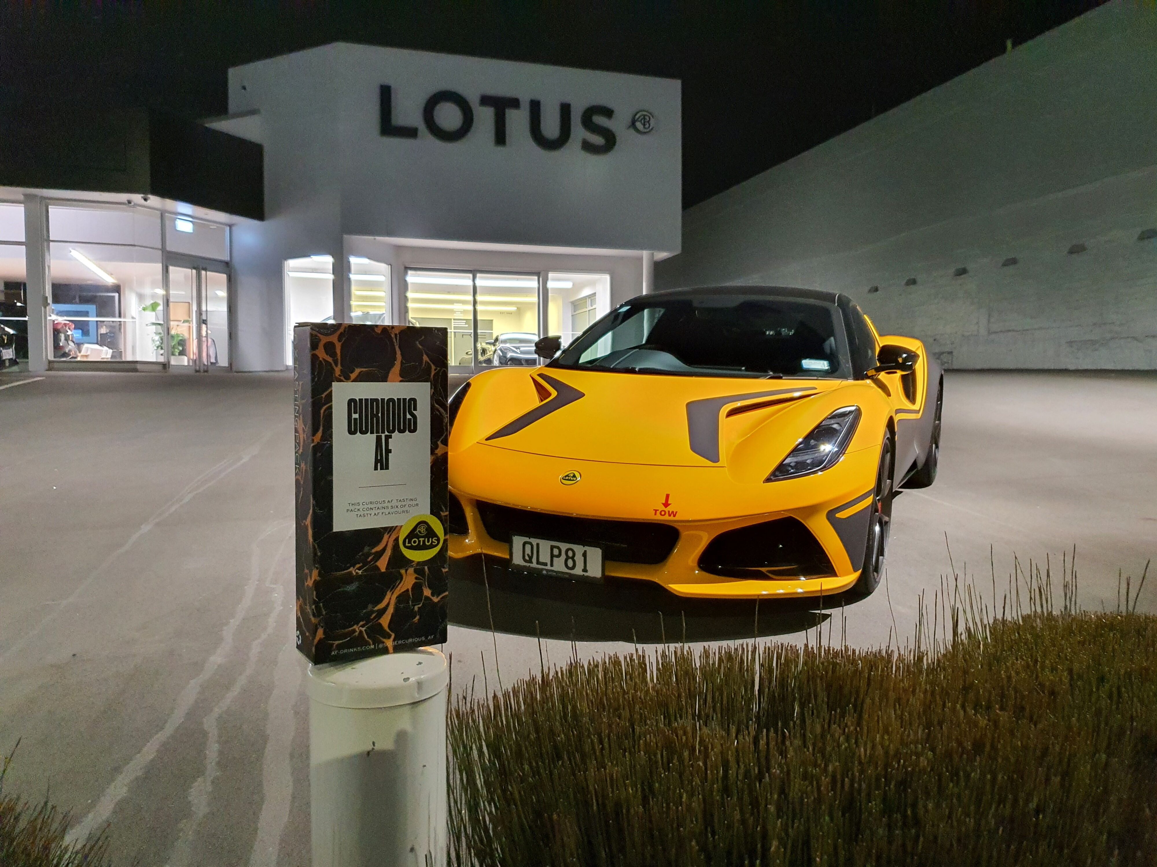 A Sober Curious AF tasting pack in front of Lotus' old home in Auckland.