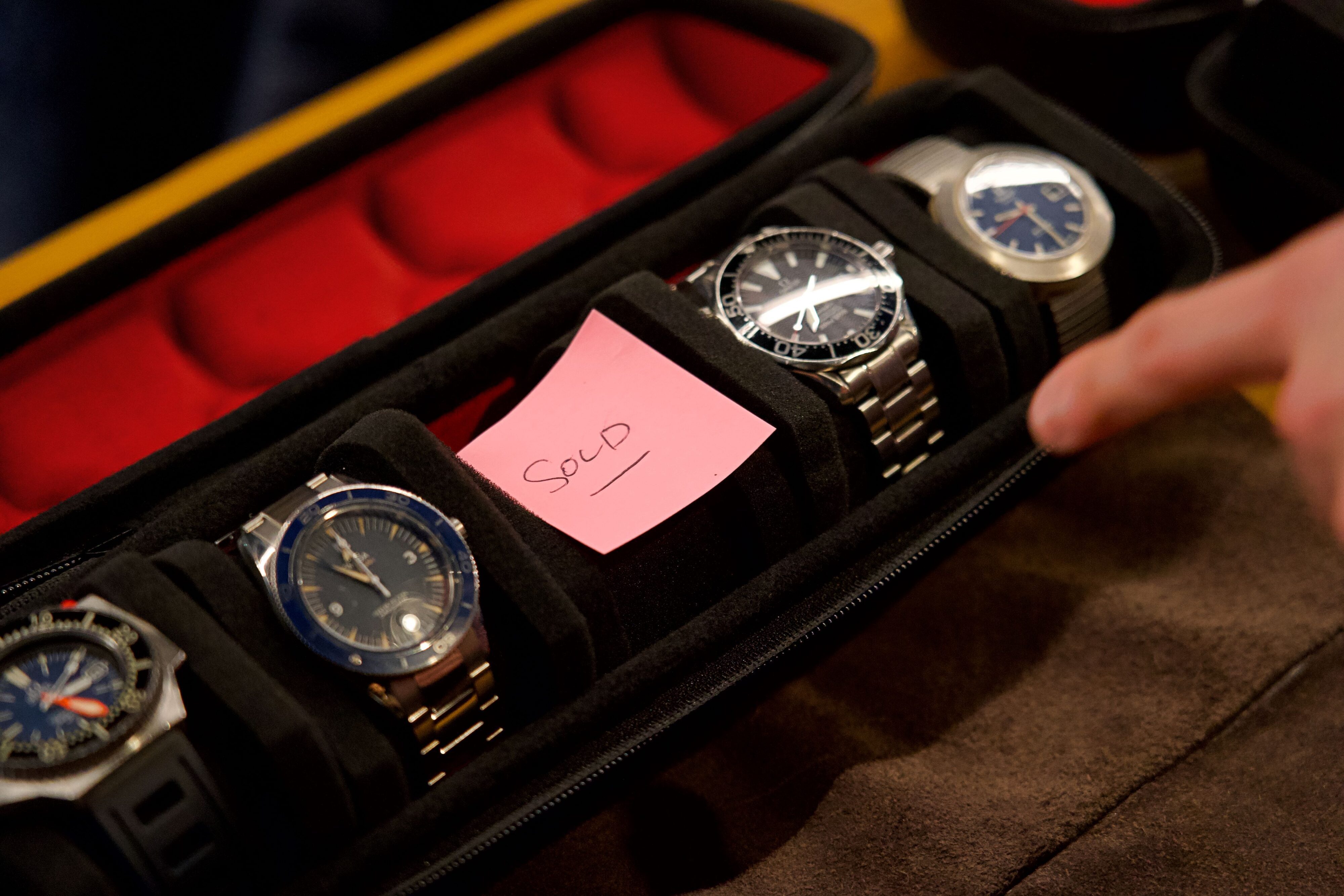 A 'sold' post-it note where an Omega Moonswatch Snoopy once sat for sale at FiveFortyFive's Auckland VIP event.