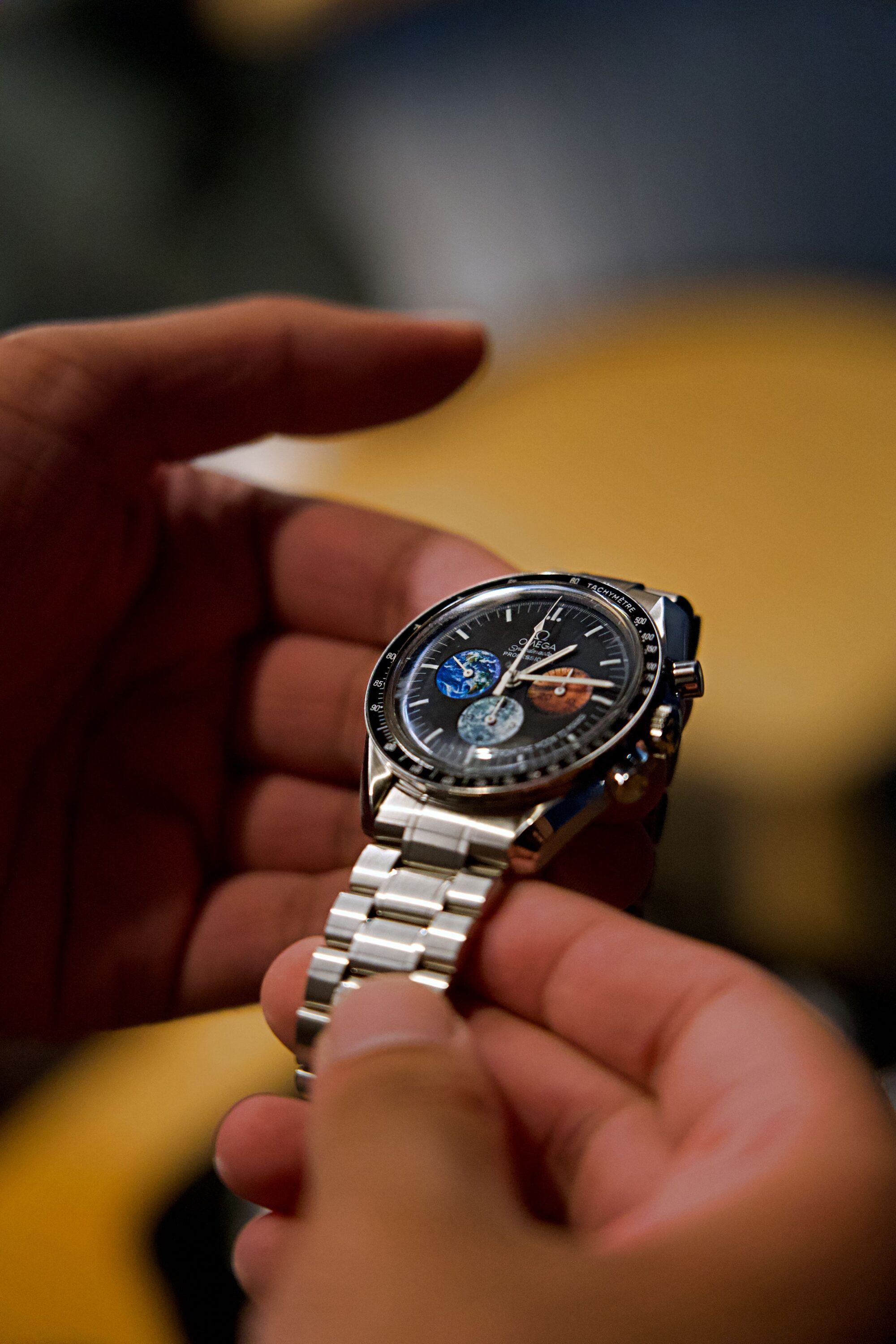Matthew D'Souza inspecting an Omega Speedmaster Moon to Mars.