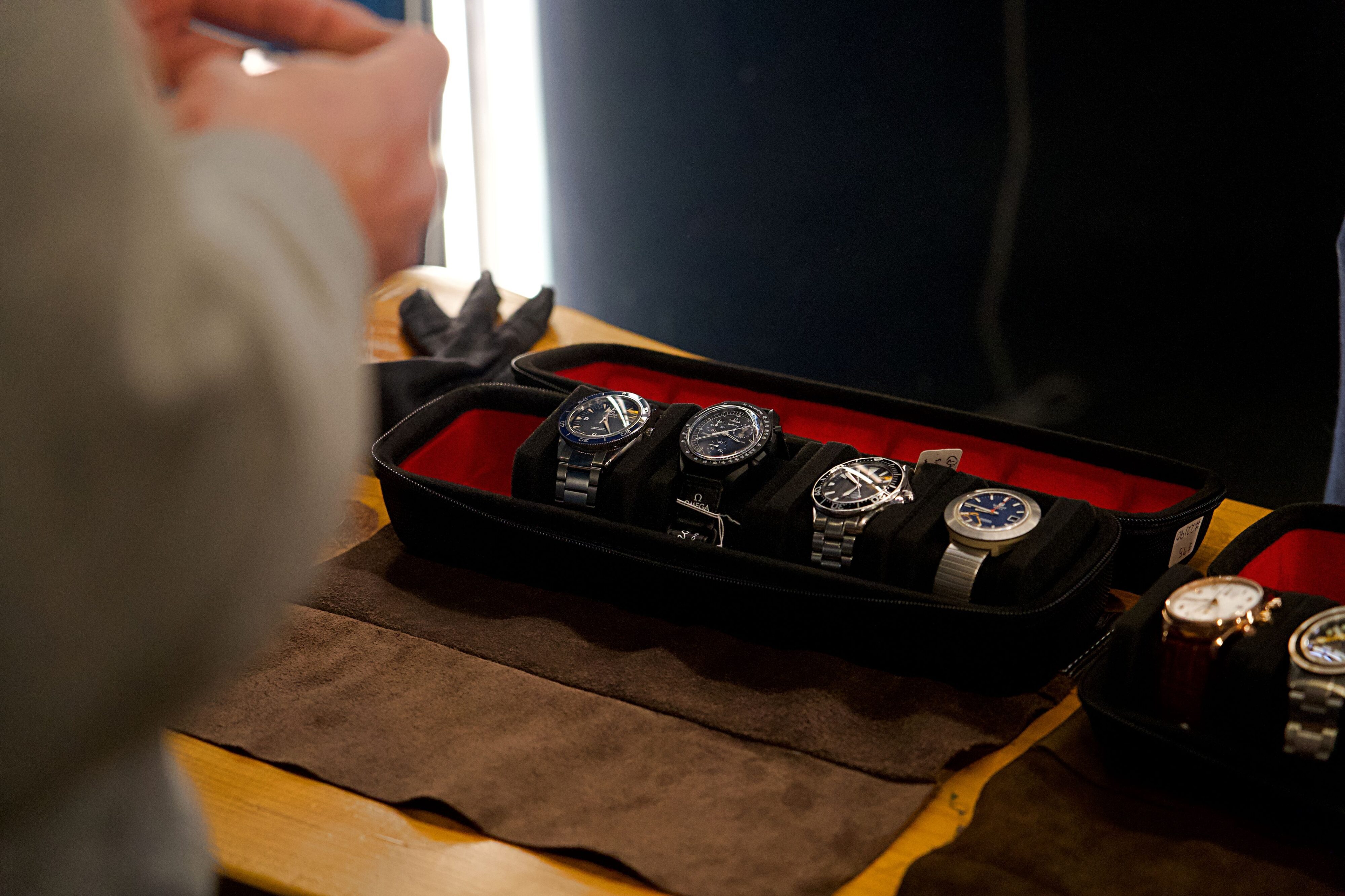 Matthew D'Souza inspecting a watch from a roll at Five:45's Auckland VIP event.