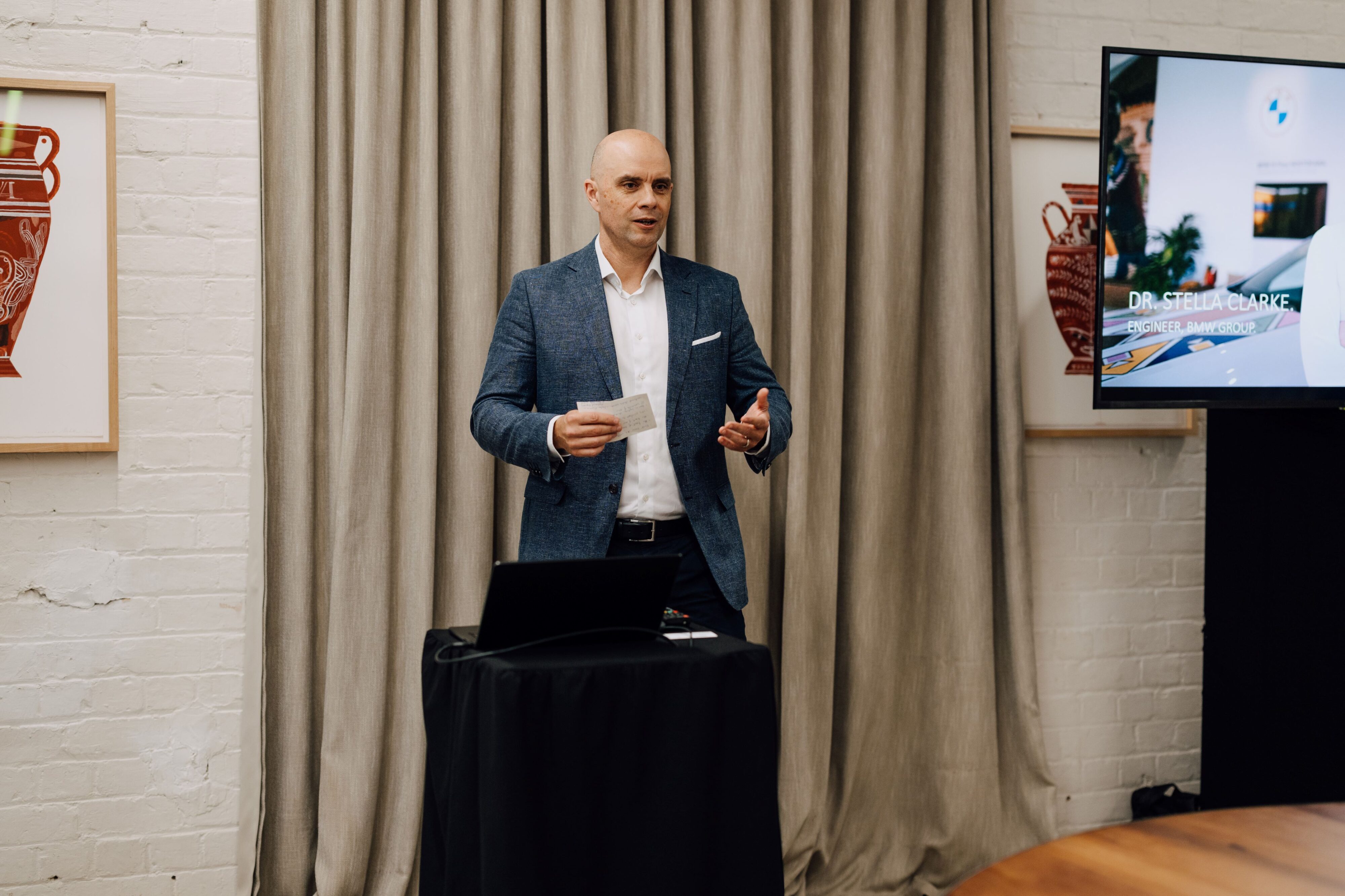 Adam Shaver, GM of BMW New Zealand introducing Dr. Stella Clarke at The Hotel Britomart.